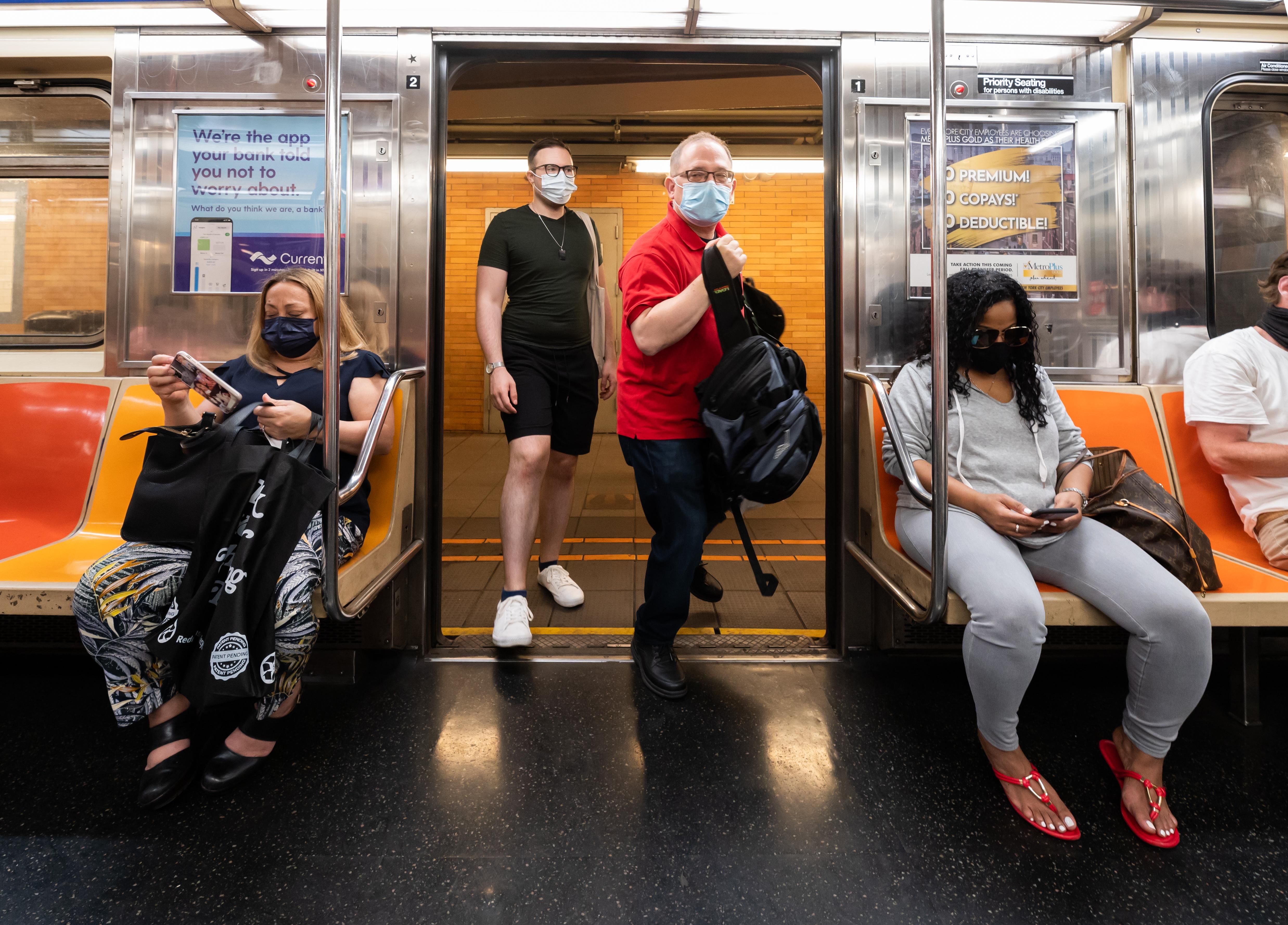 People ride the New York City subway on May 26, 2021. 