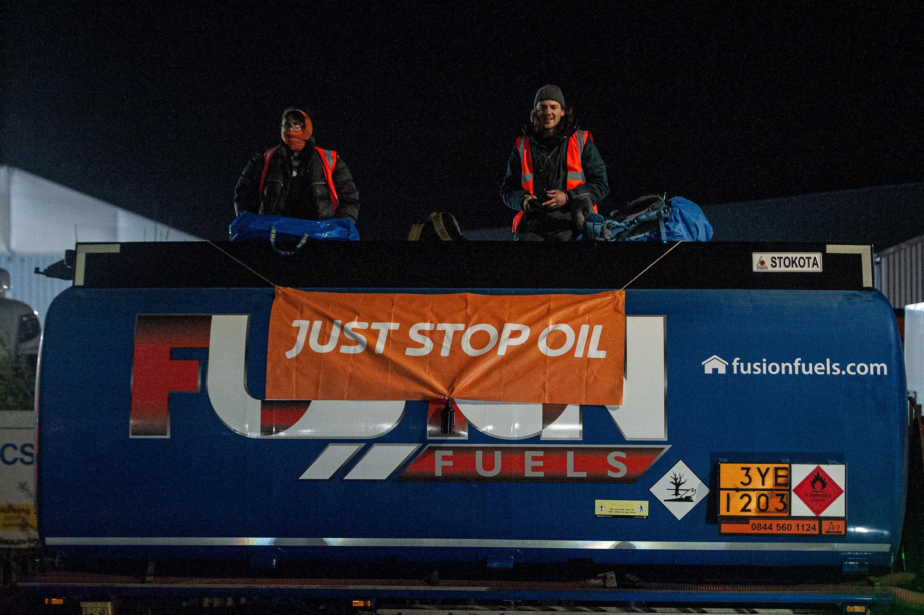 Activists from the 'Just Stop Oil' coalition shut down a terminal by boarding fuel transport vehicles on April 1, 2022 in Grays, England.