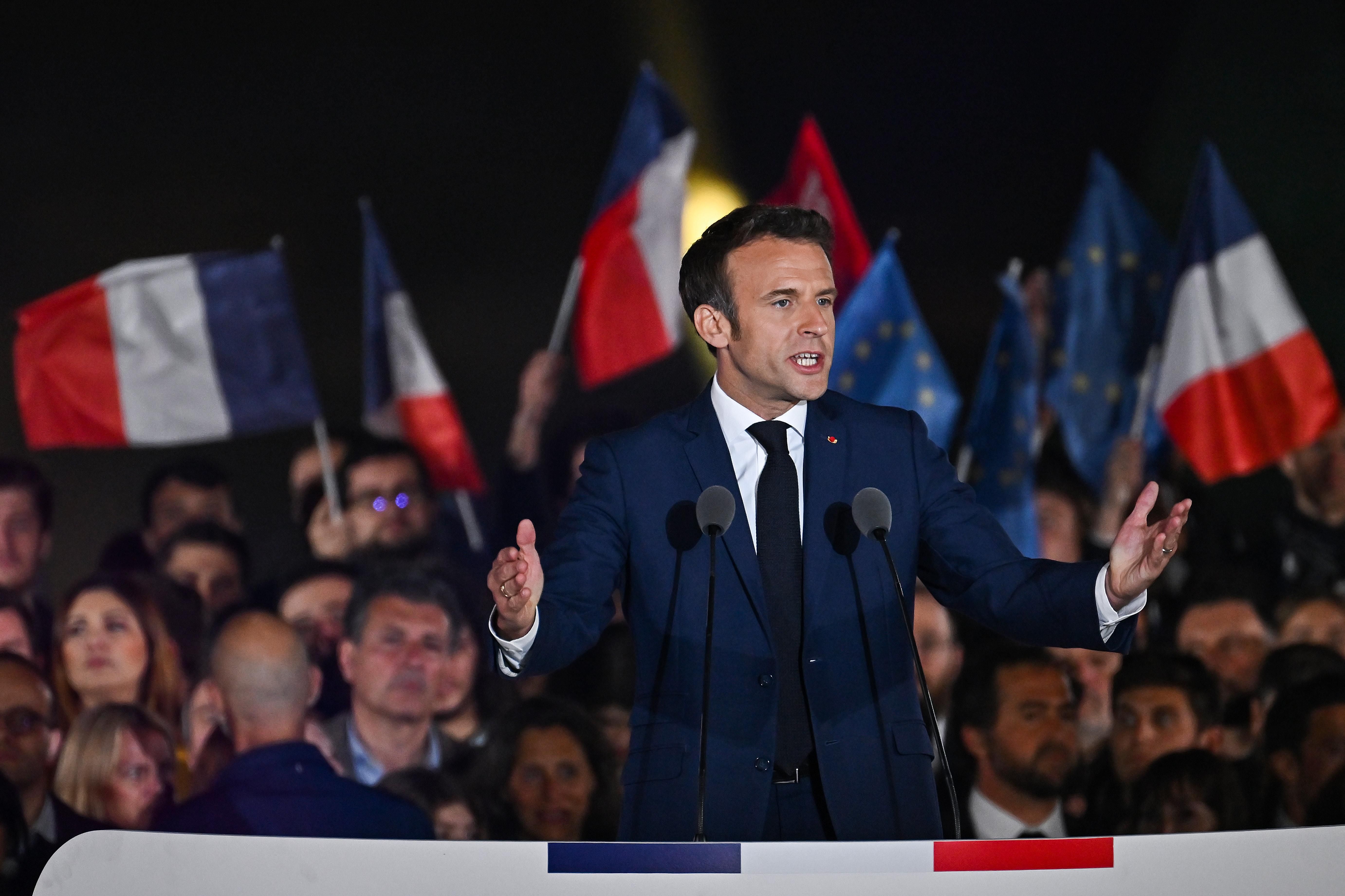 Neoliberal French President Emmanuel Macron speaks in Paris on April 24, 2022 after beating far-right candidate Marine Le Pen for a second five-year term. 