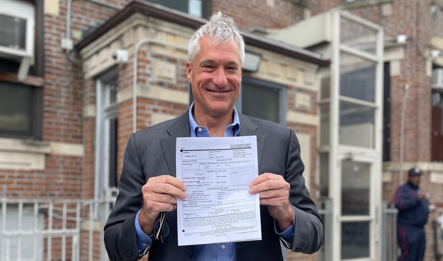 Steven Donziger shows his release papers