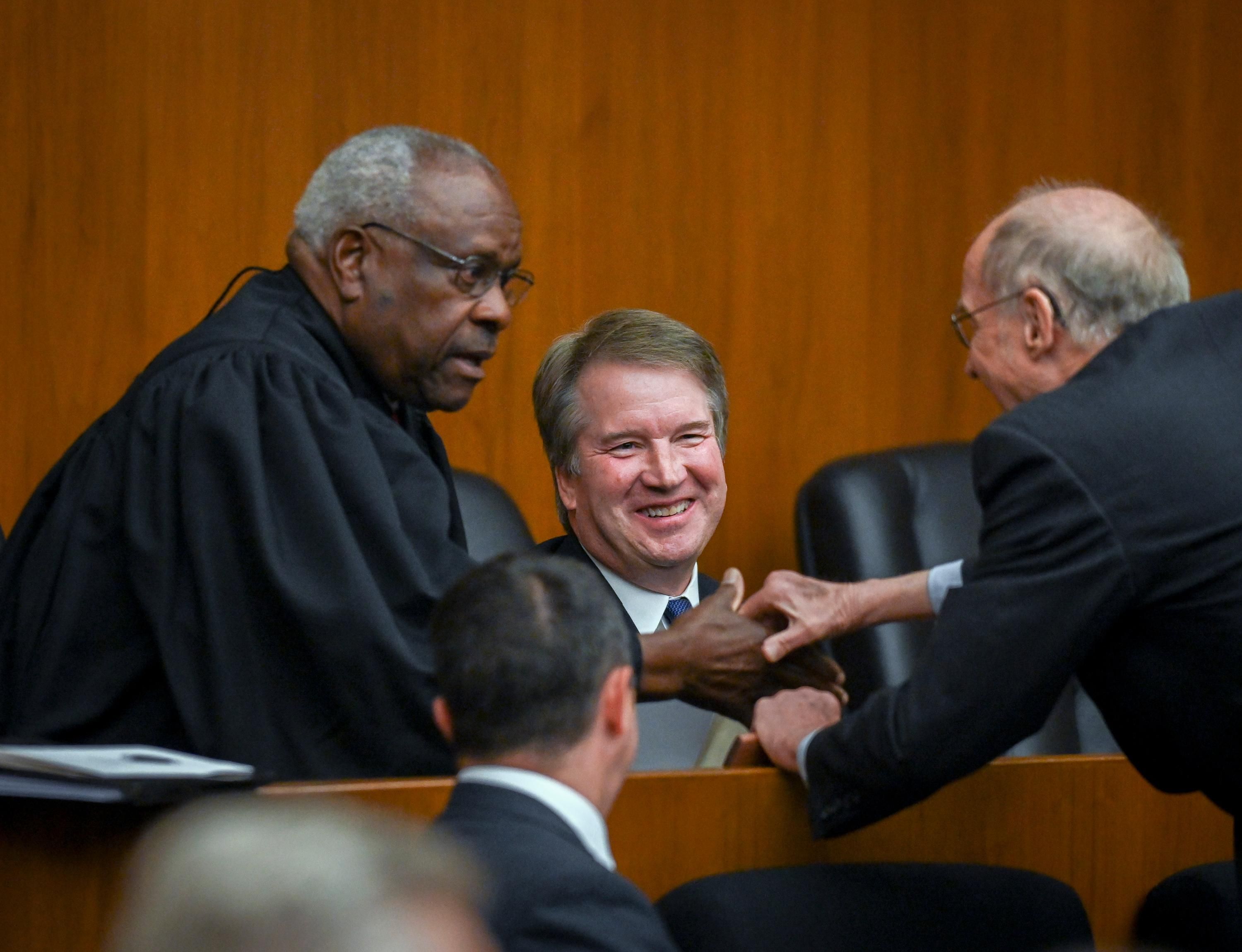 Supreme Court Justices Clarence Thomas and Brett Kavanaugh appear at a ceremony