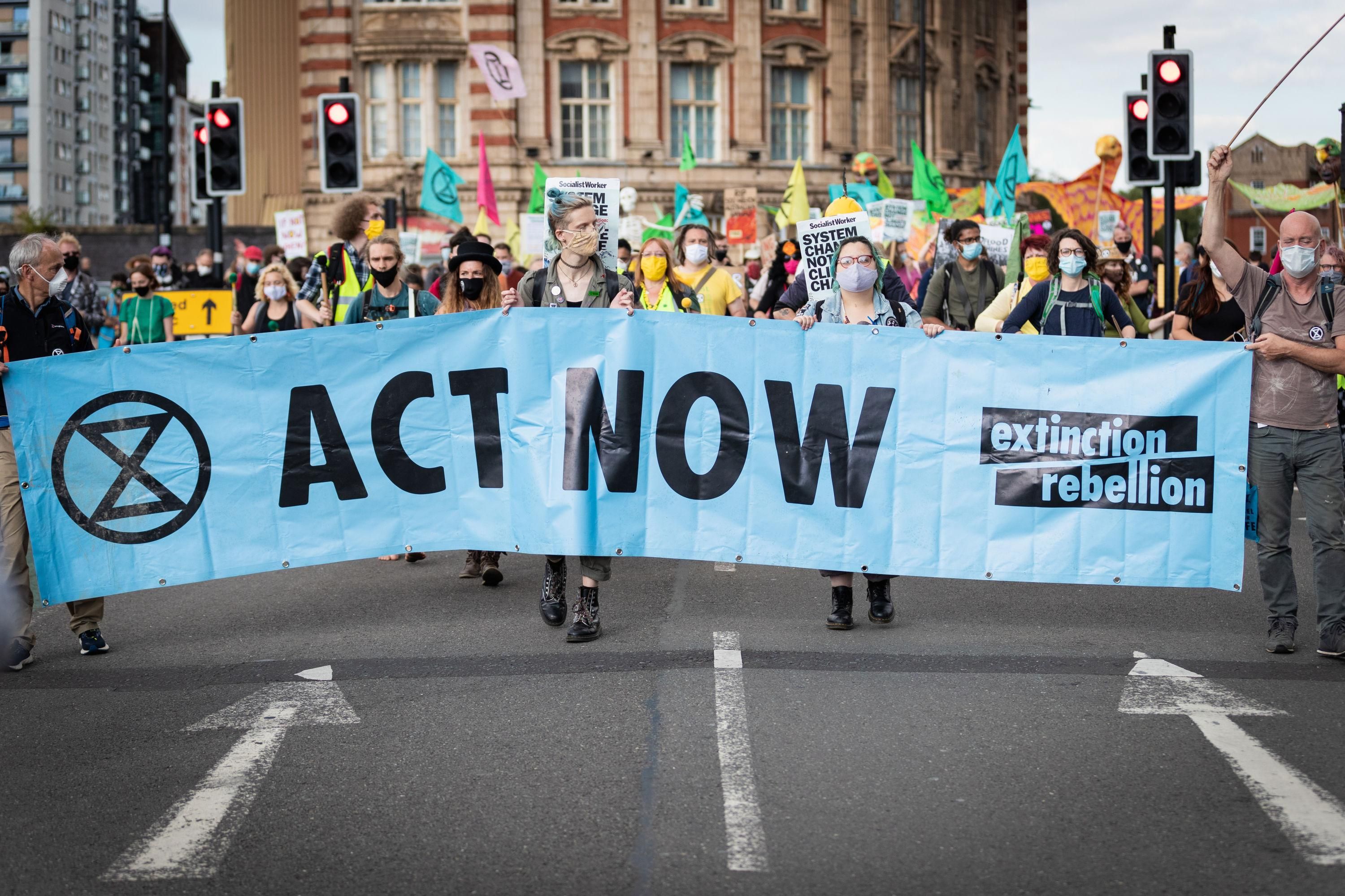 Members of Extinction Rebellion march in Manchester, United Kingdom on September 1, 2020
