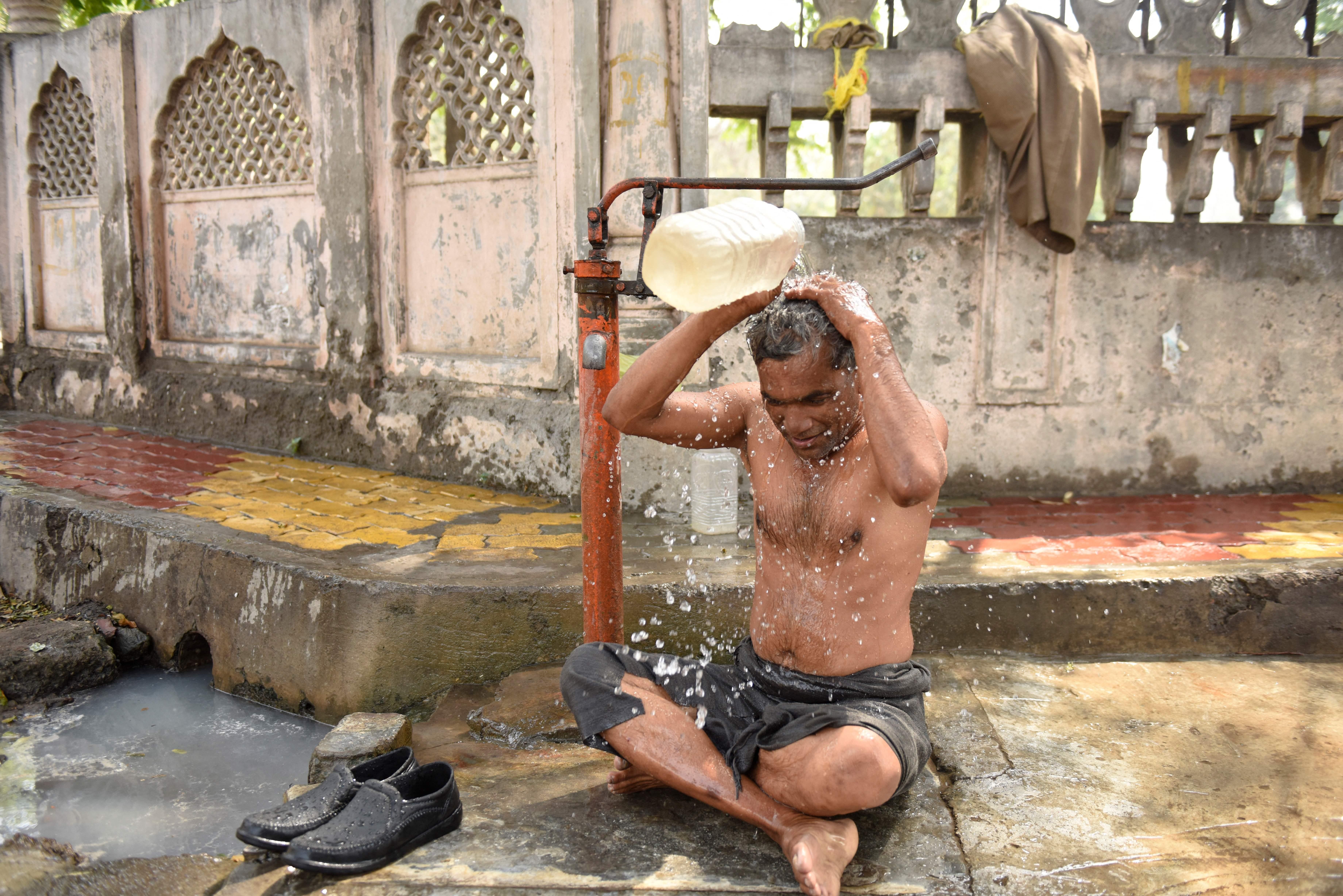A man tries to cool off during a heatwave in Amritsar, India on April 30, 2022. 