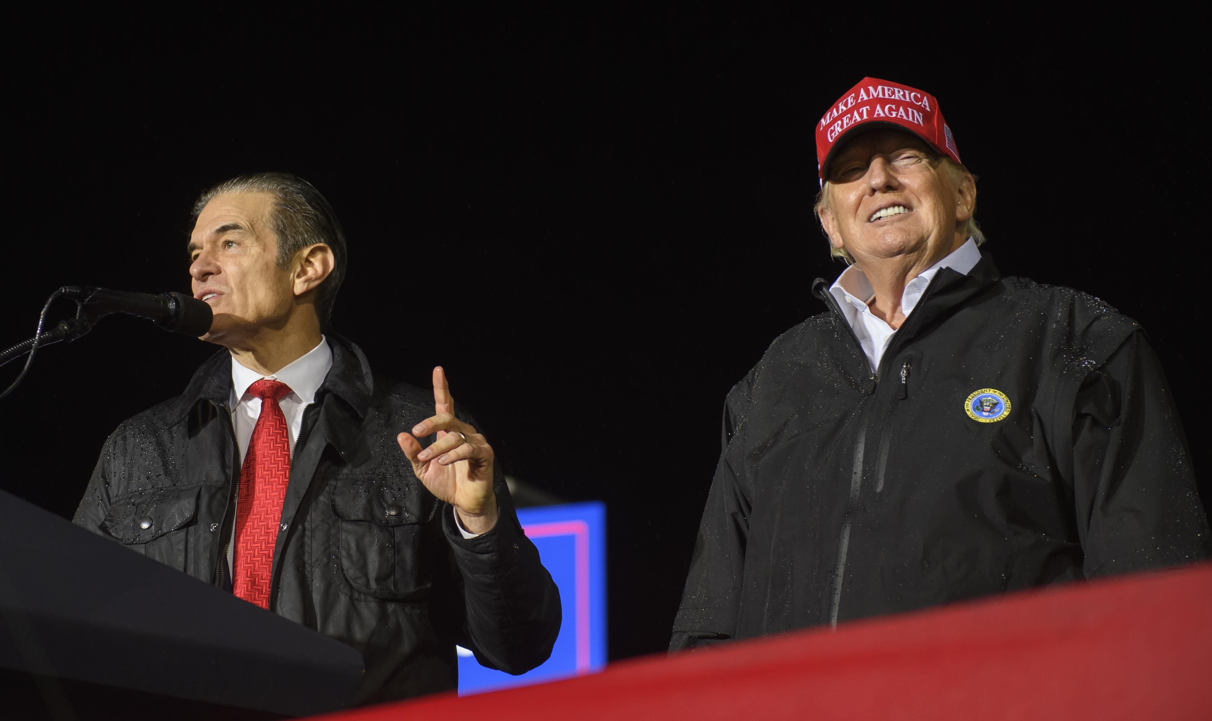 Pennsylvania Republican U.S. Senate candidate Dr. Mehmet Oz joins former President Donald Trump on stage during a campaign at the Westmoreland County Fairgrounds on May 6, 2022 in Greensburg, Pennsylvania. 