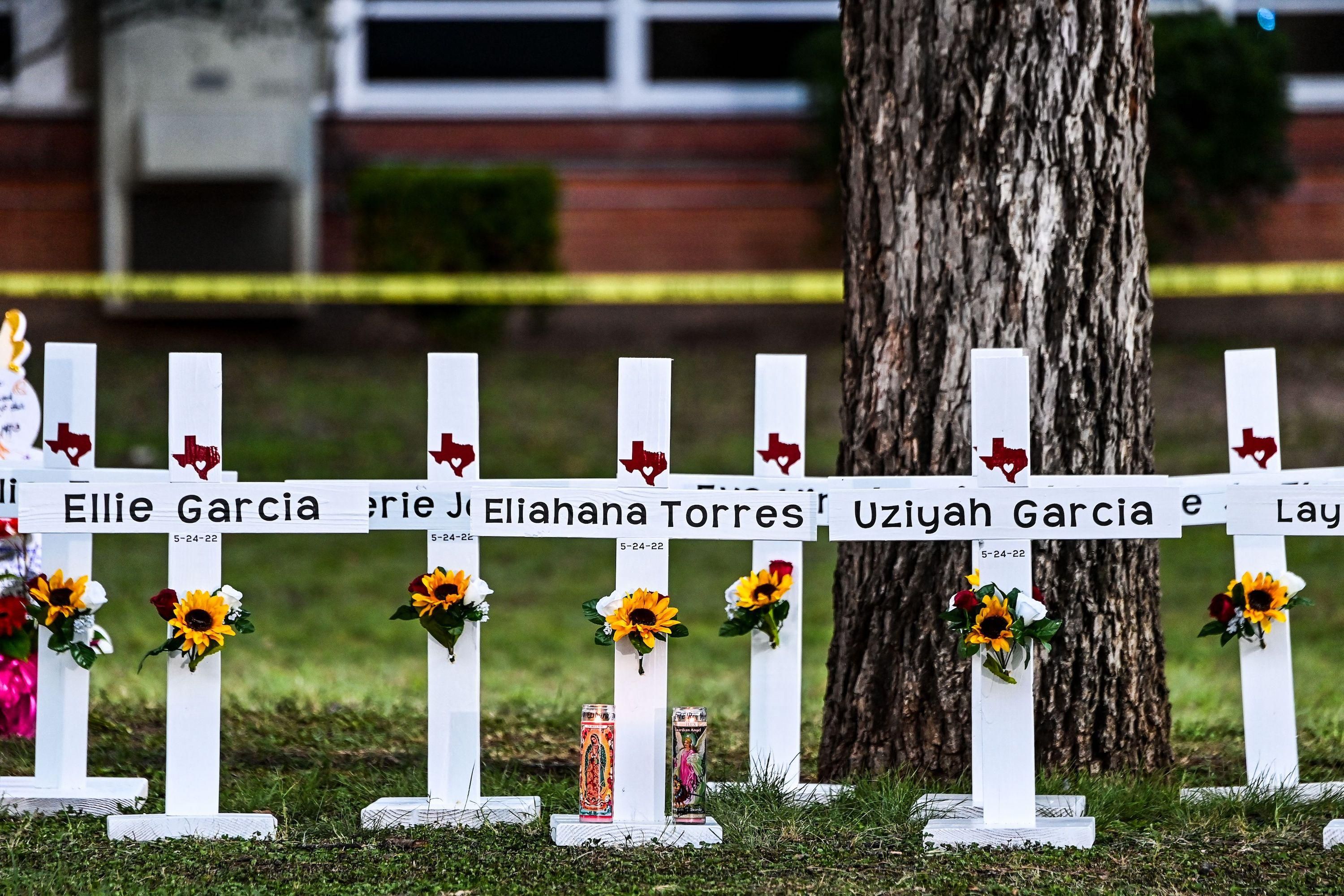 Crosses adorn a makeshift memorial for the shooting victims at Robb Elementary School in Uvalde, Texas, on May 26, 2022. 