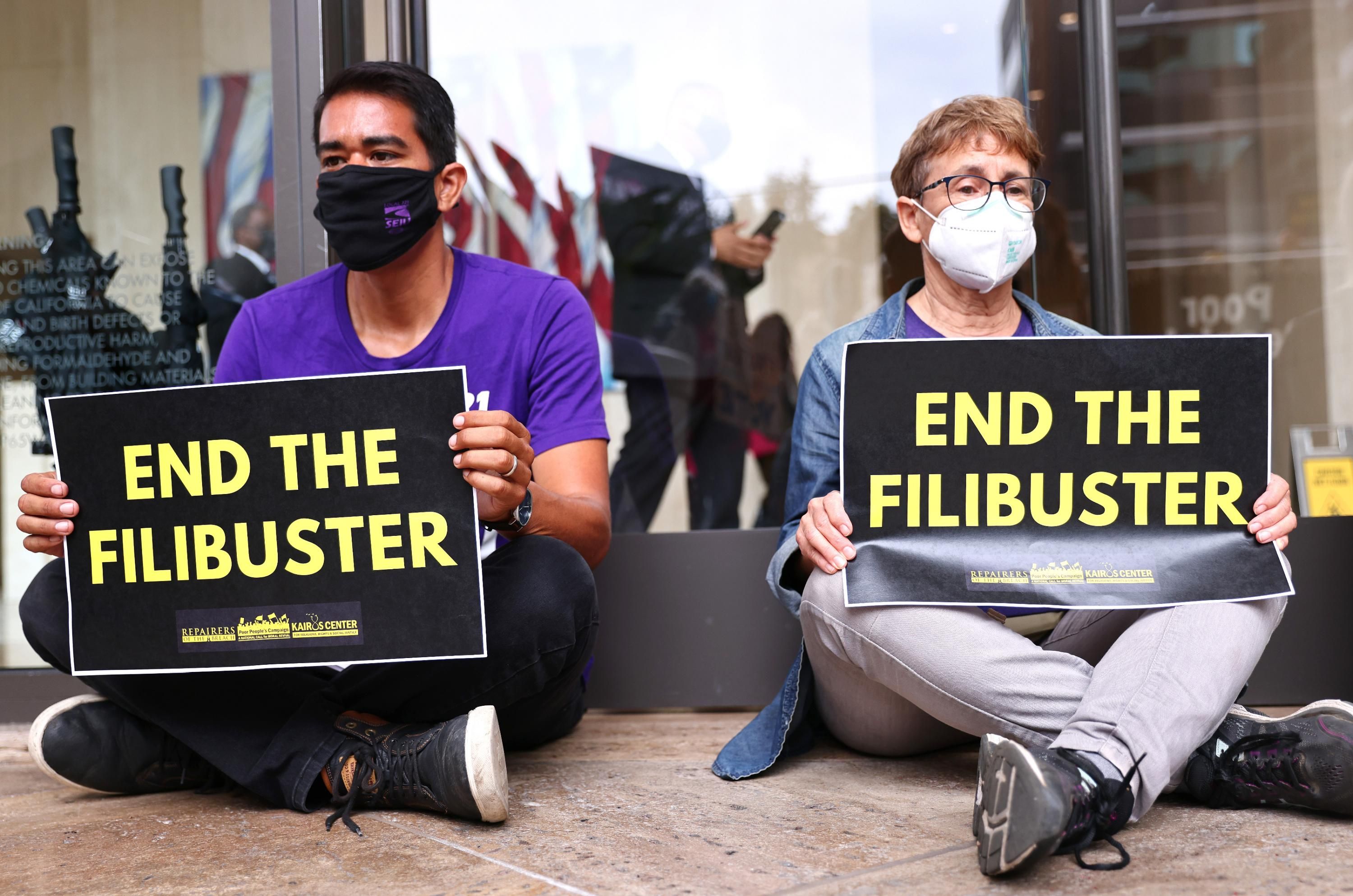 Demonstrators hold a sit-in calling for an end to the filibuster