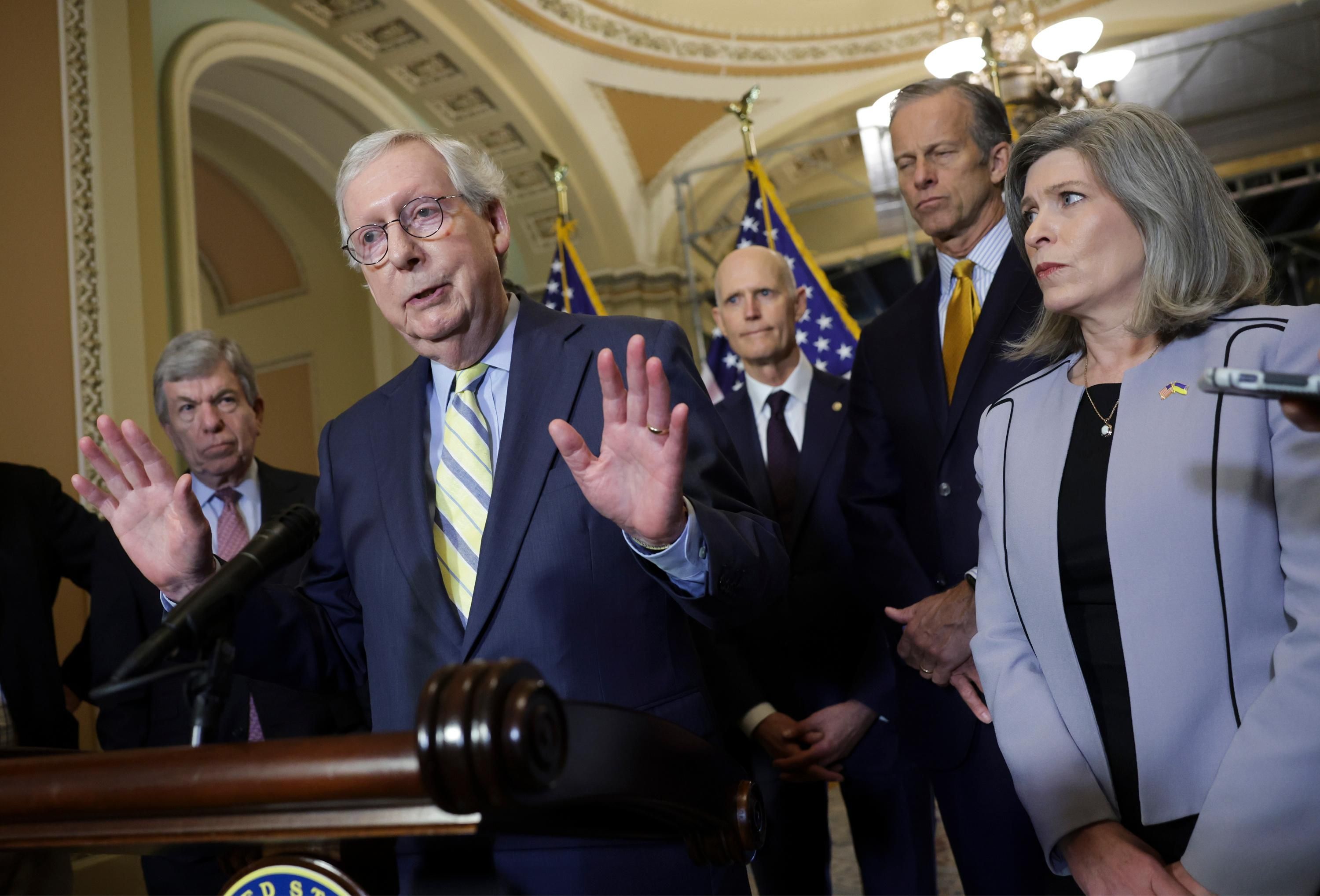 Senate Minority Leader Mitch McConnell speaks to reporters