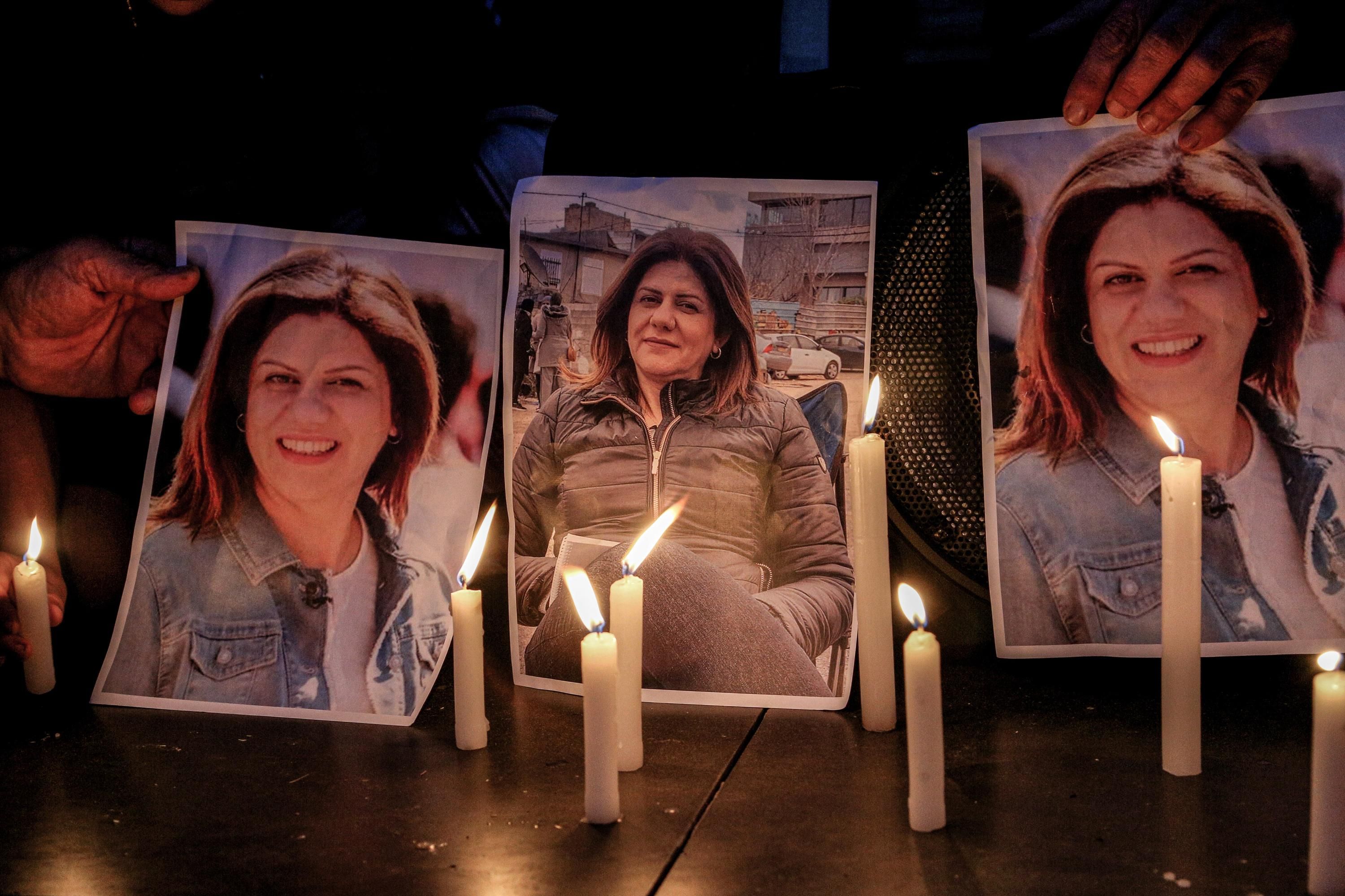 Activists take part in a candlelight vigil outside the U.N.'s Economic and Social Commission for West Asia building in Beirut to denounce the killing of Al Jazeera reporter Shireen Abu Akleh