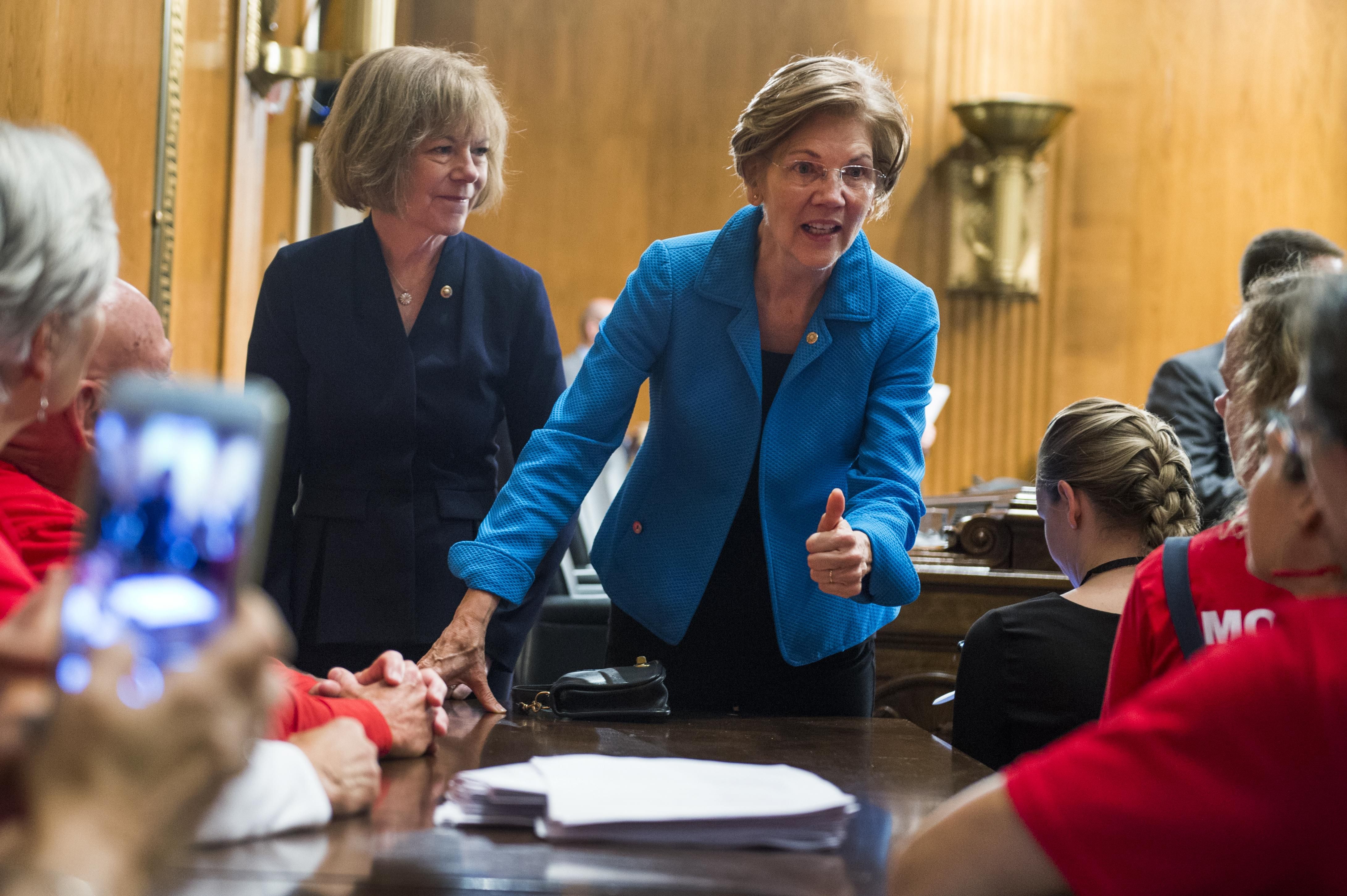 Sens. Elizabeth Warren (D-Mass.) and Tina Smith (D-Minn.) attend a Senate Health, Education Labor, and Pensions Committee hearing in Washington, D.C. on September 25, 2018. 