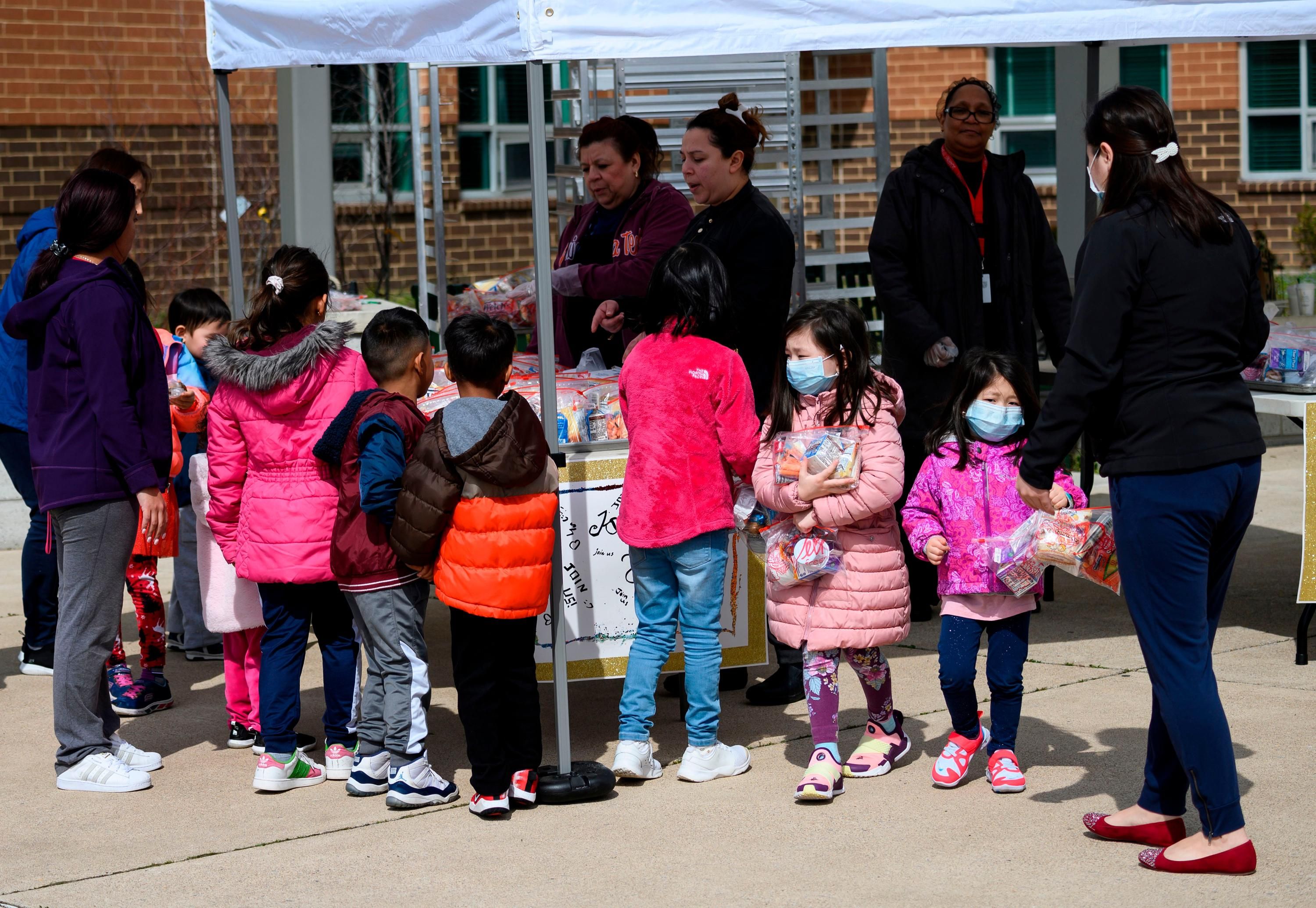 Children pick up free school lunches