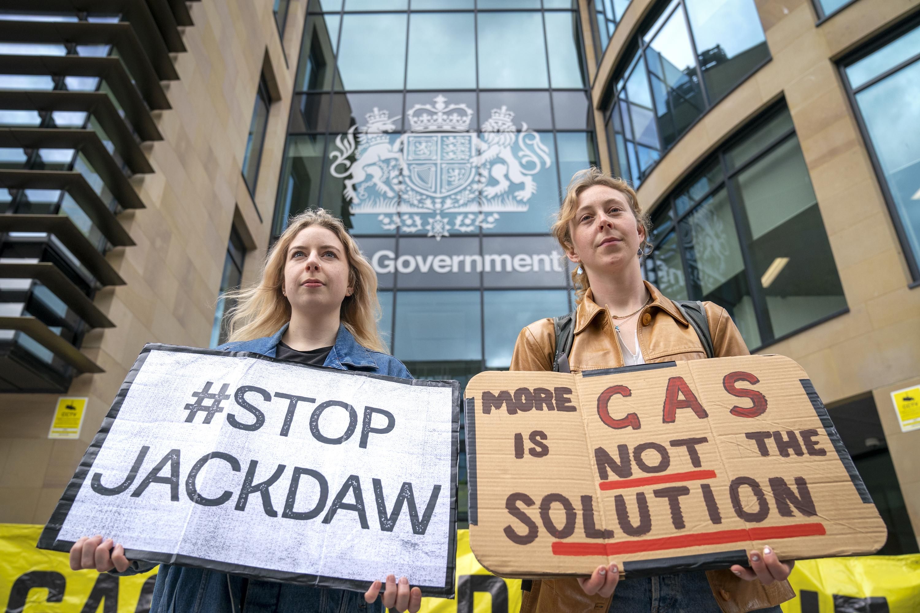 Environmental campaigners from Friends of the Earth protest outside the U.K. government building in Edinburgh to demand the U.K. government reverse its decision to approve Shell's Jackdaw gas field in the North Sea and instead move away from fossil fuels, on June 2, 2022. (Photo: Jane Barlow/PA Images via Getty Images)
