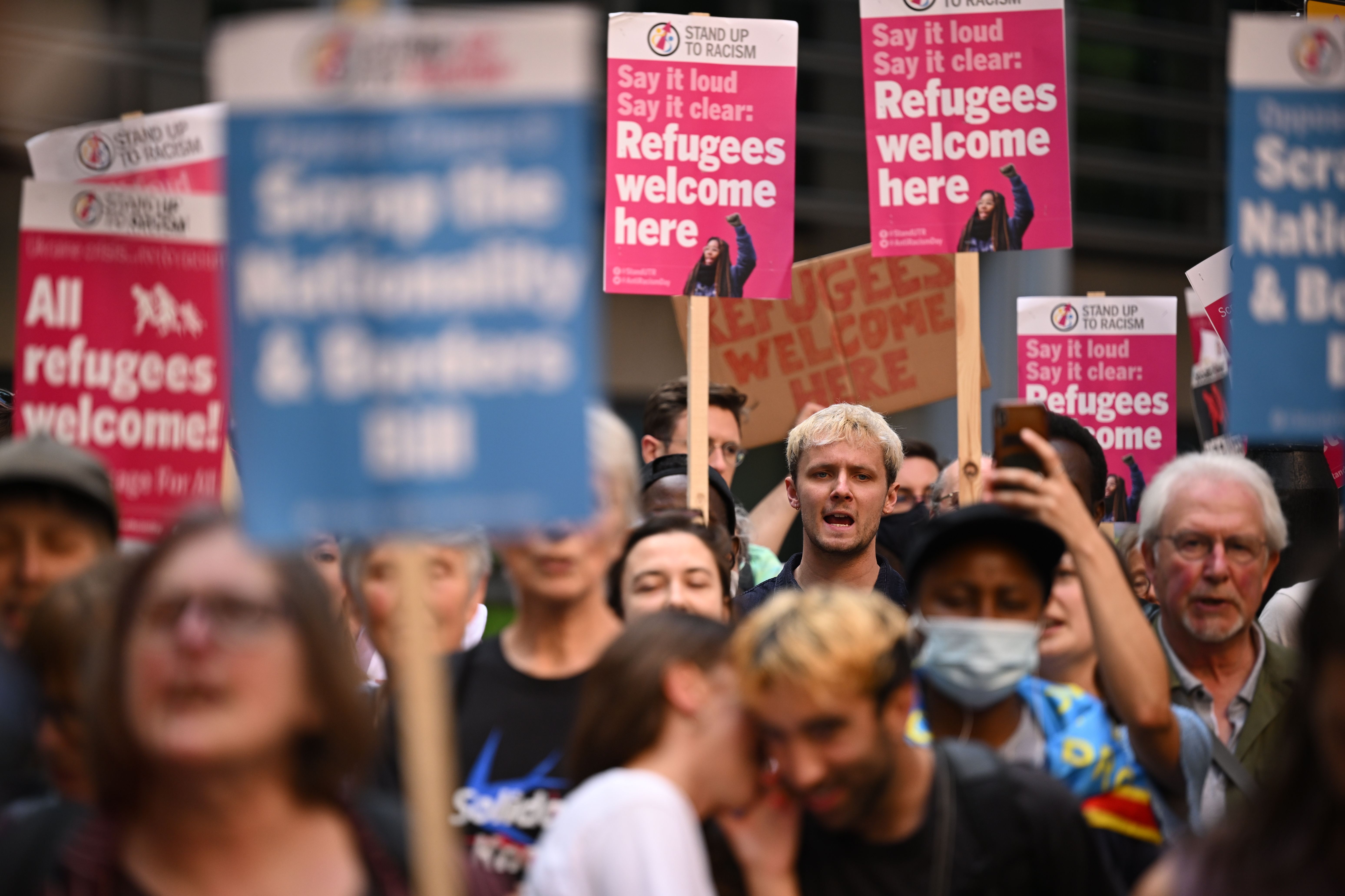 Hundreds of people gather outside the U.K. Home Office in London on June 13, 2022 to protest Prime Minister Boris Johnson's plan to deport some asylum-seekers to Rwanda.