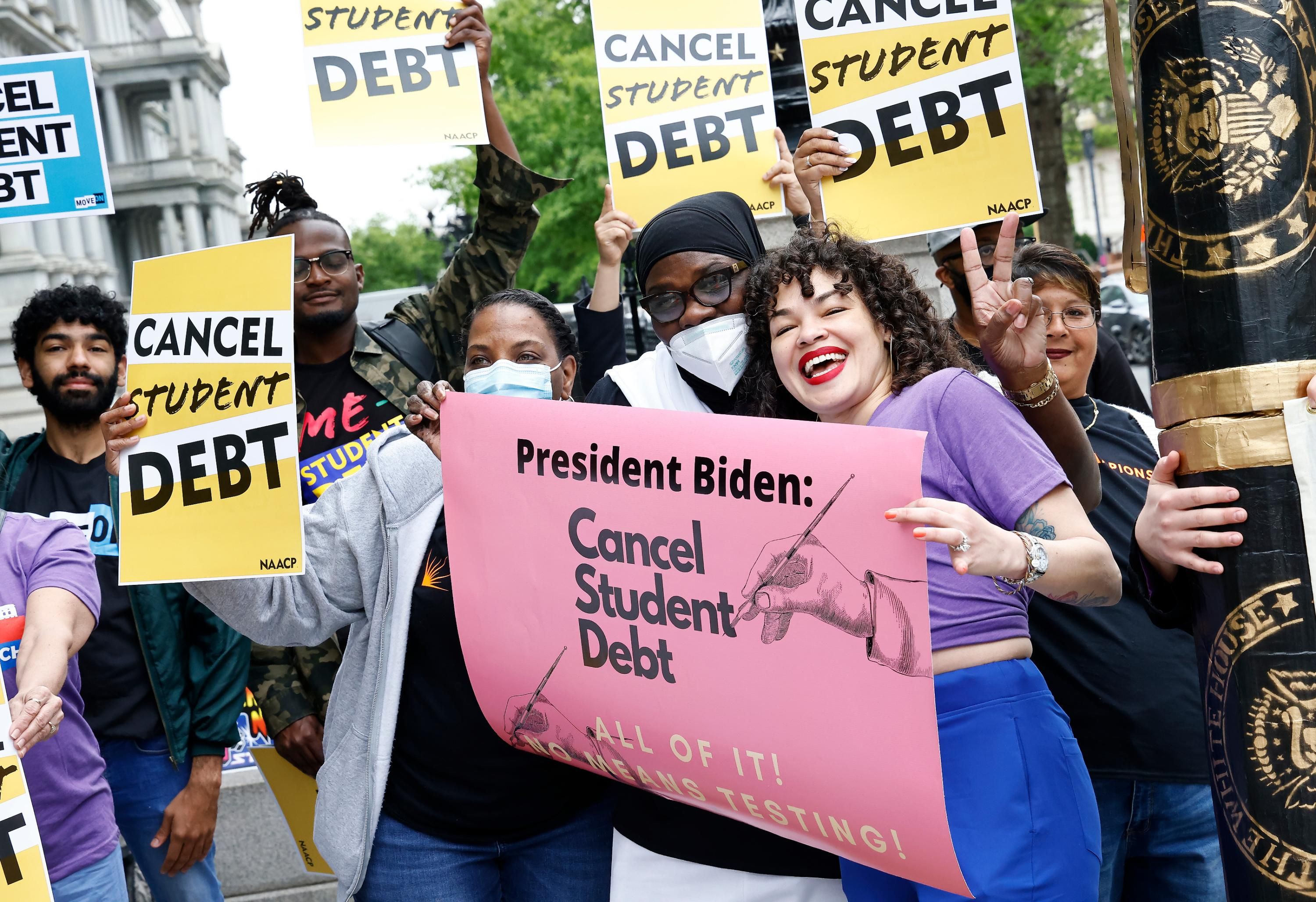 Demonstrators urge President Joe Biden to cancel student loan debt