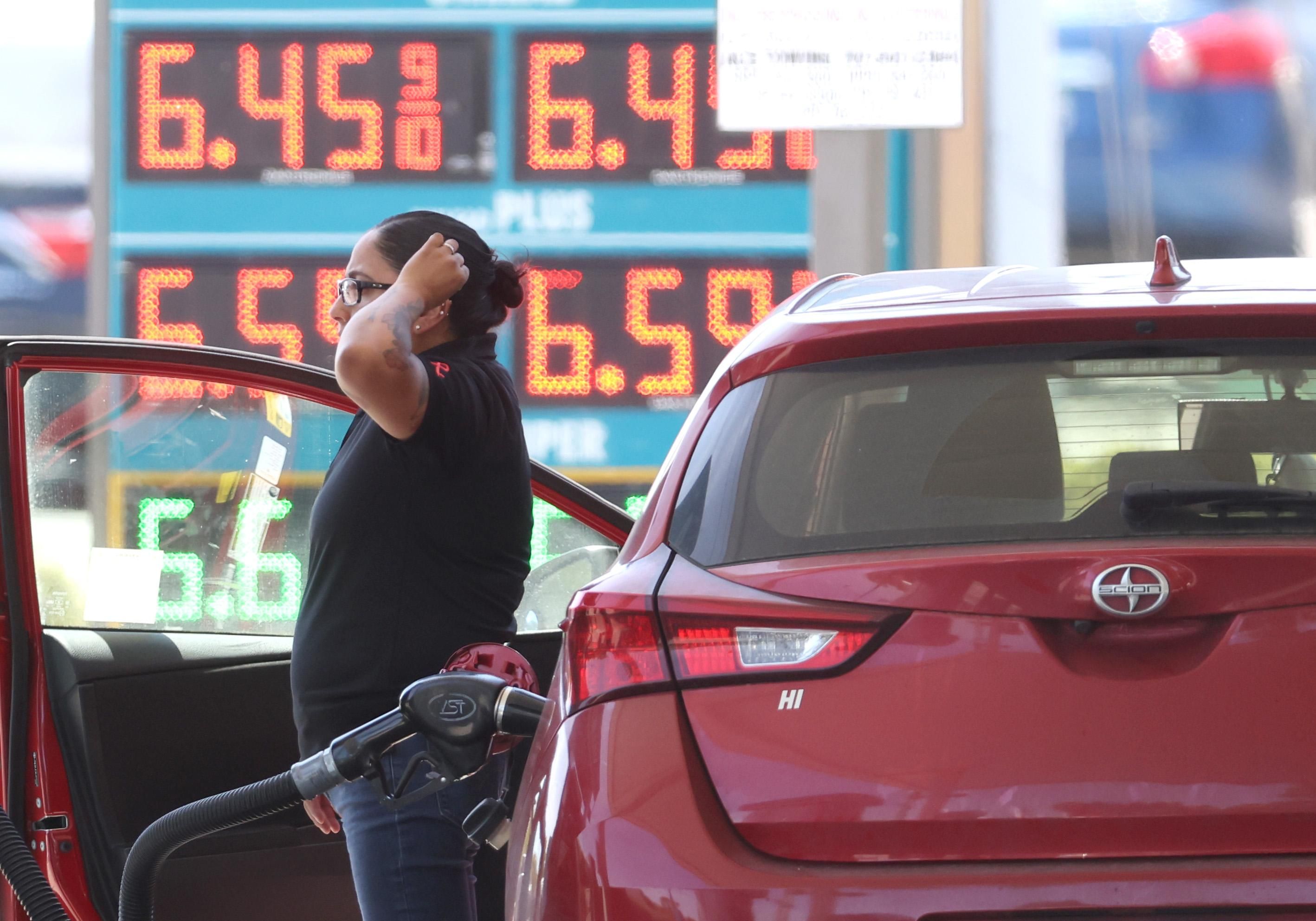 A customer refuels their car at a gas station in Petaluma, California on May 18, 2022.