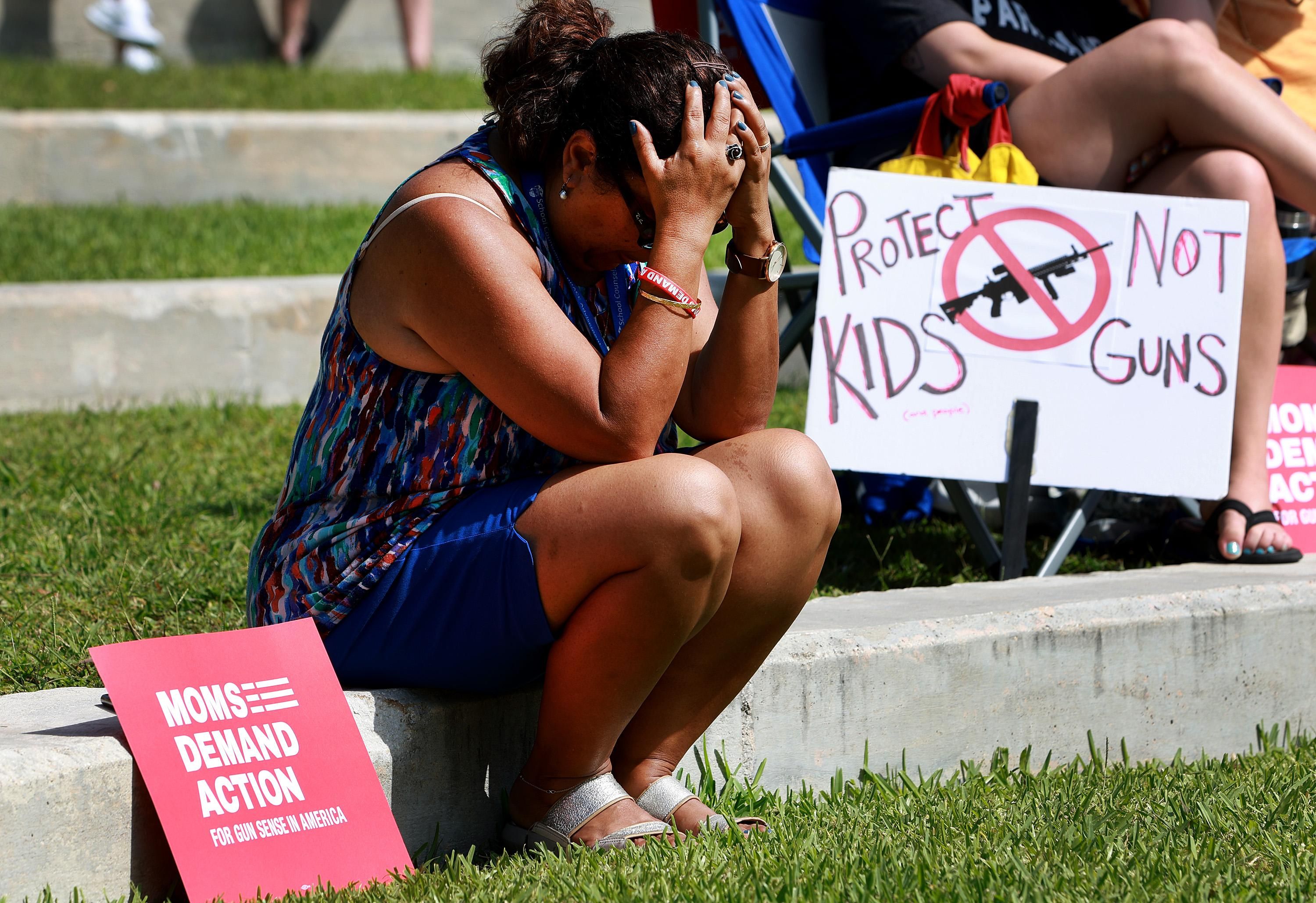 Woman mourning gun massacre