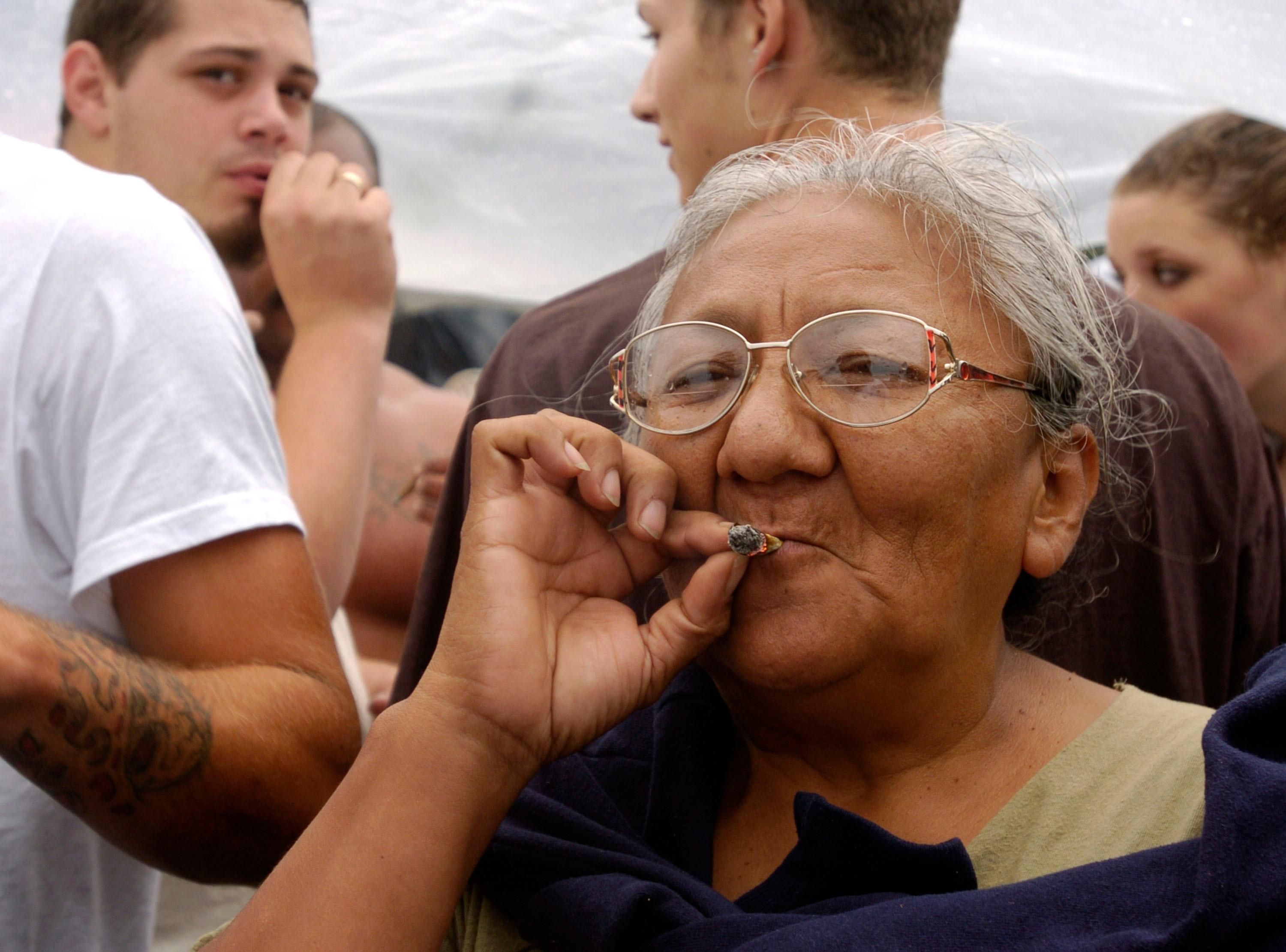 A woman smokes marijuana