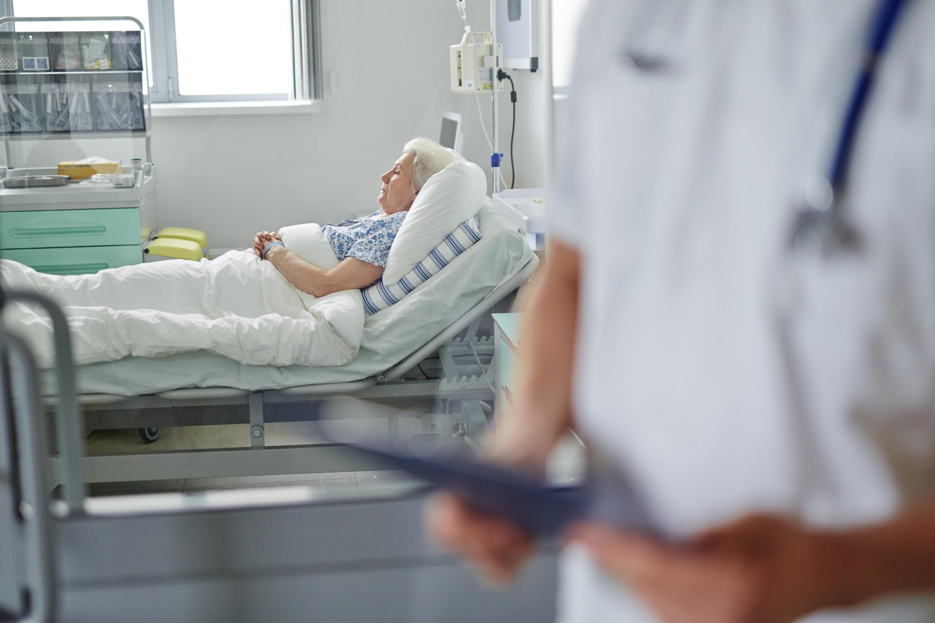 A senior woman is pictured in an intensive care unit