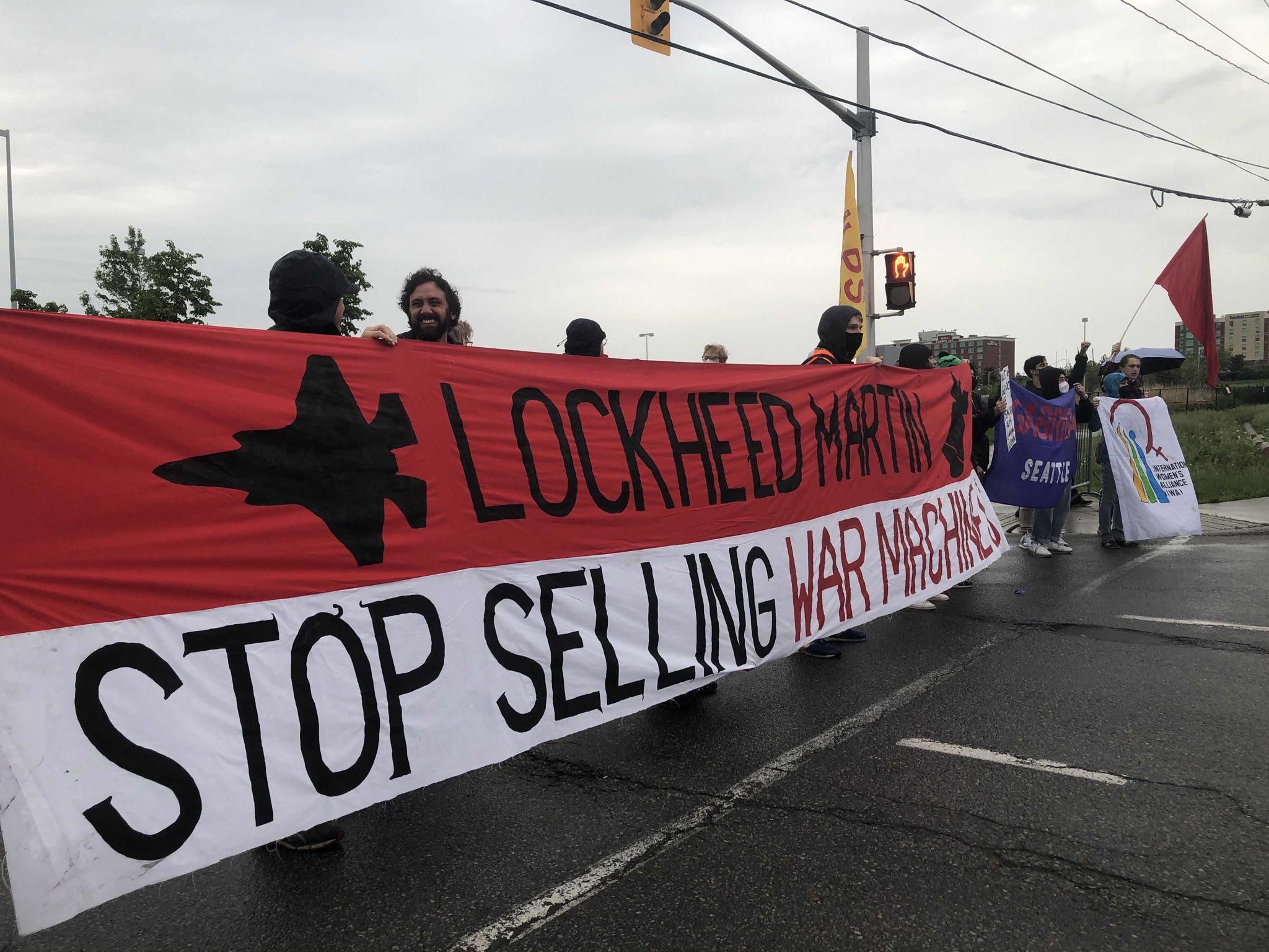 Anti-war activists protest outside of CANSEC, North America's largest weapons fair, in Ottawa on June 1, 2022.