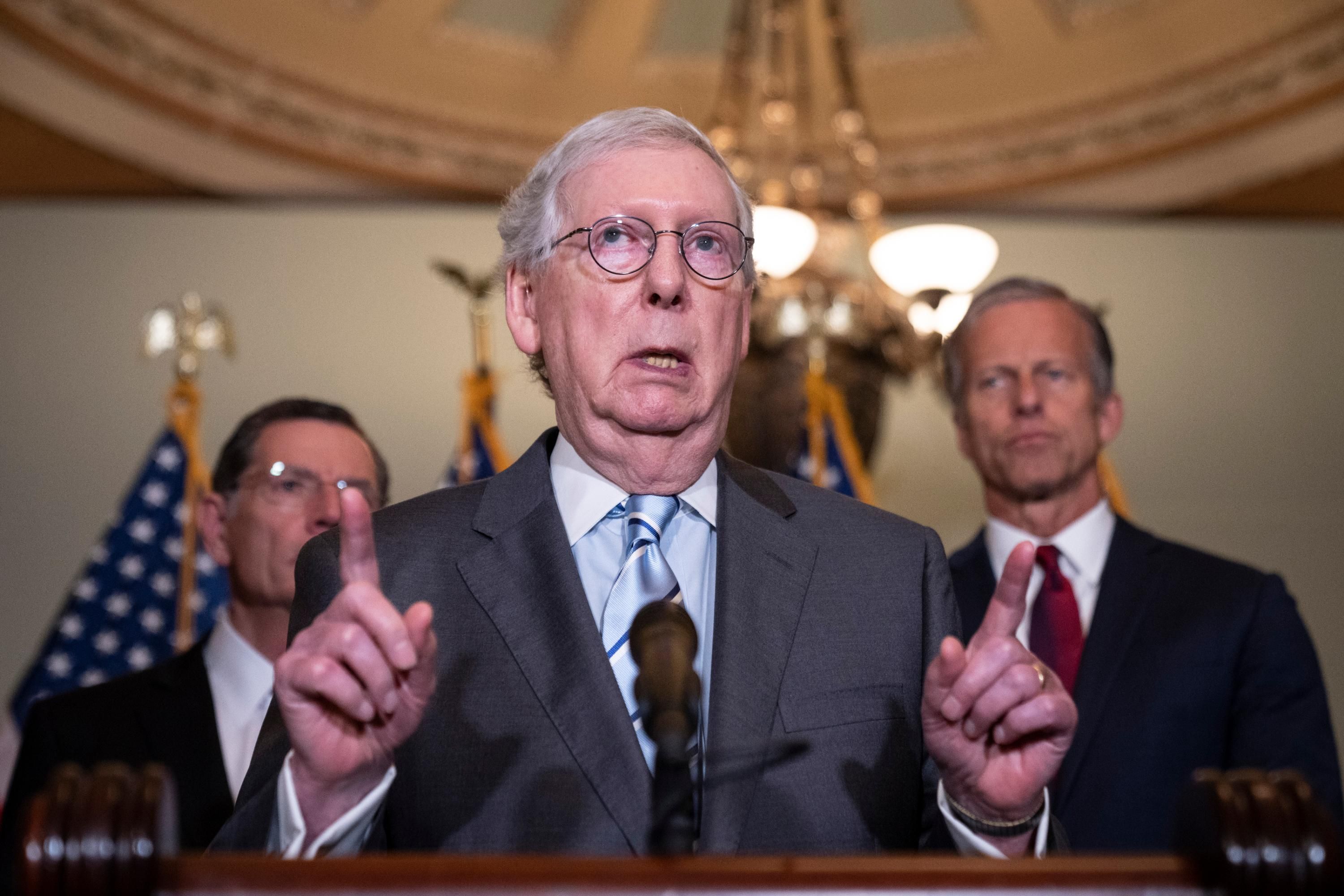 Senate Minority Leader Mitch McConnell speaks to reporters
