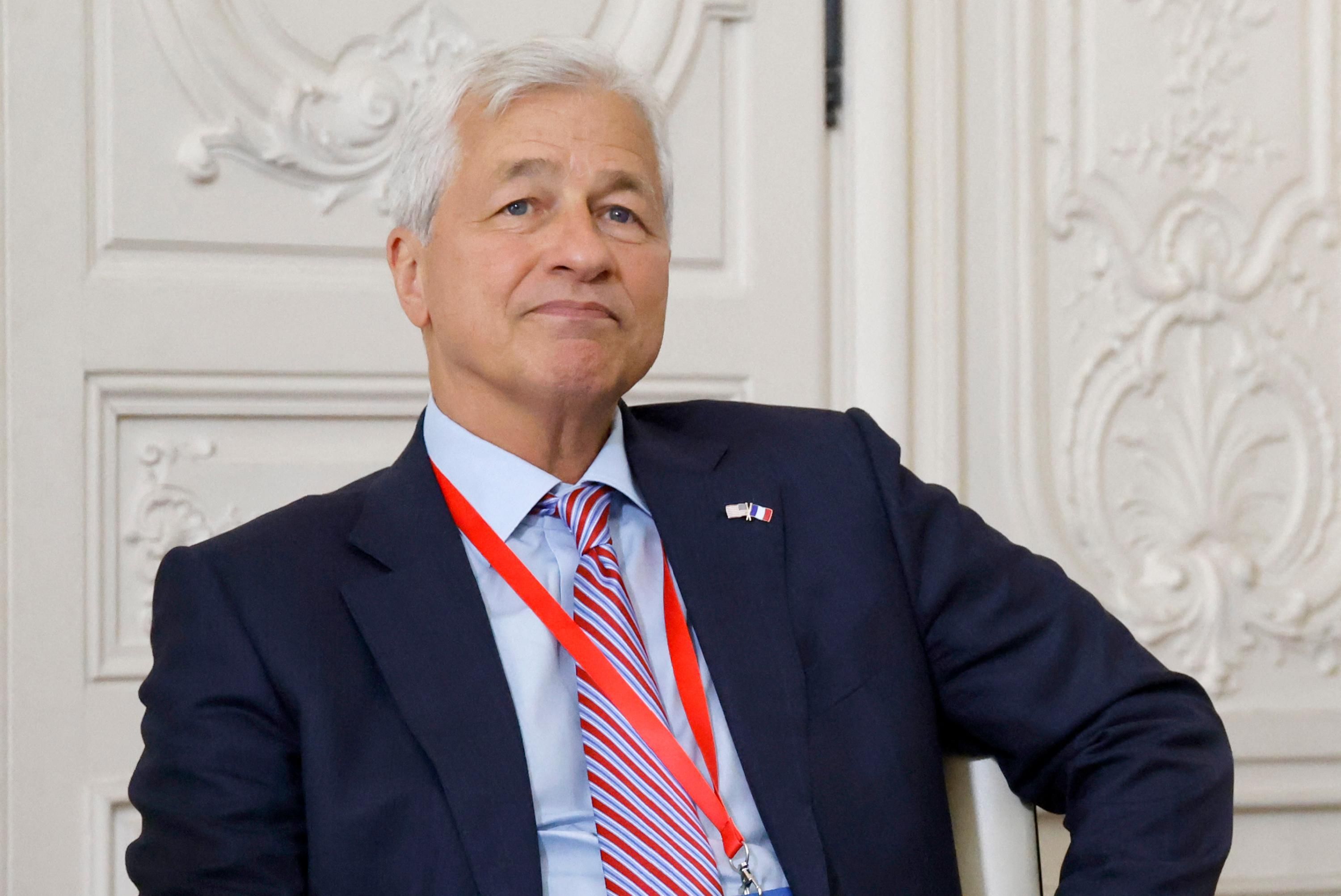 JPMorgan Chase CEO Jamie Dimon looks on during a meeting