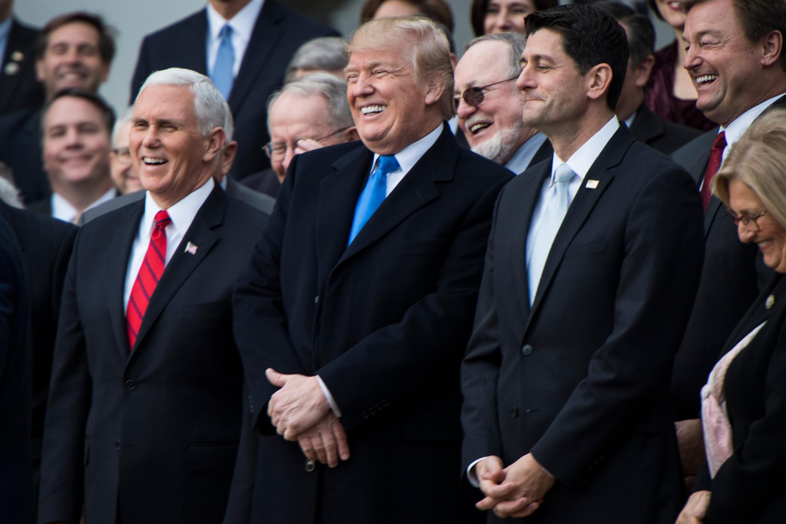 Donald Trump and Republican lawmakers celebrate passage of their tax-cut bill