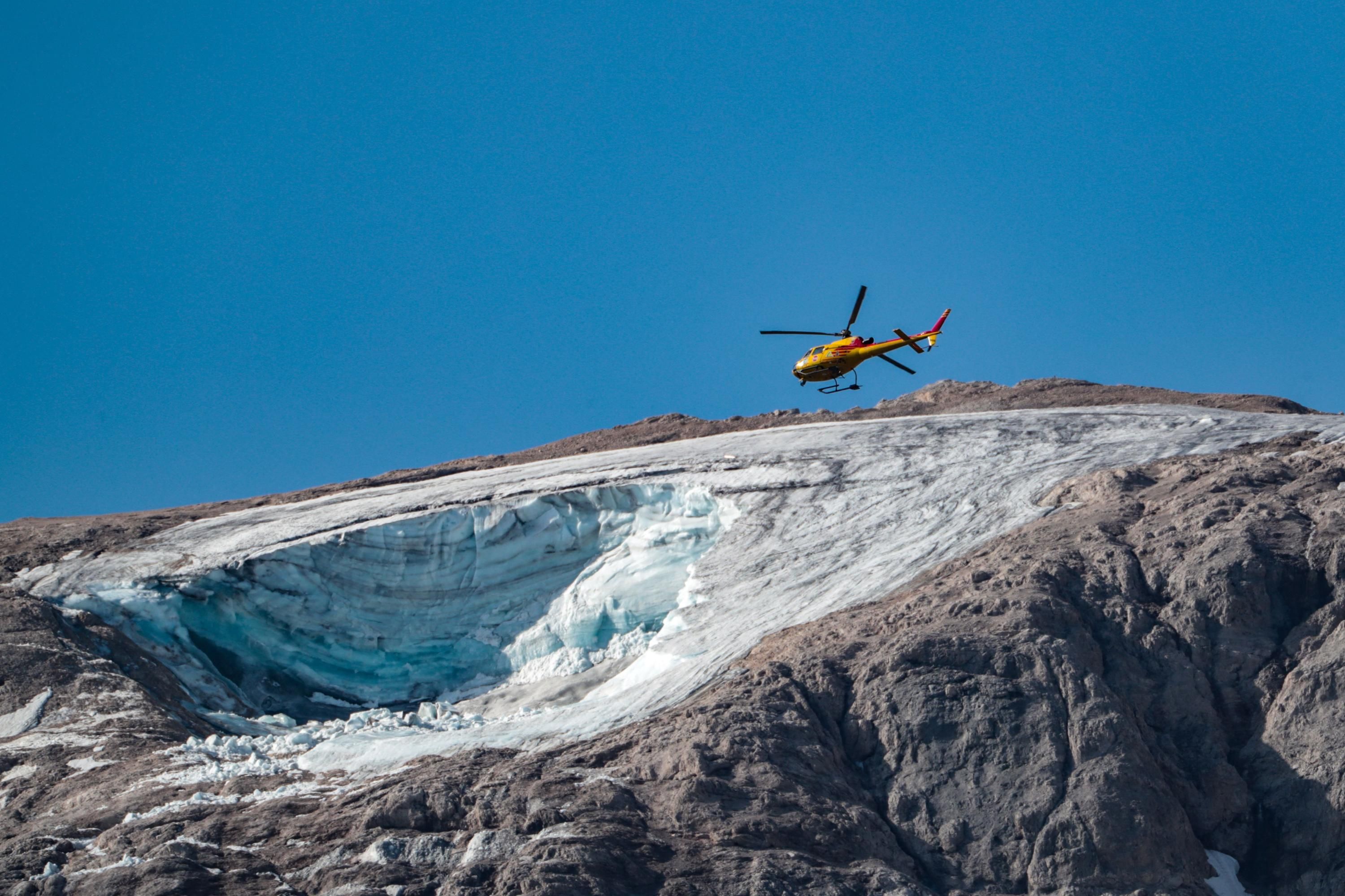 A rescue helicopter over collapsed glacier