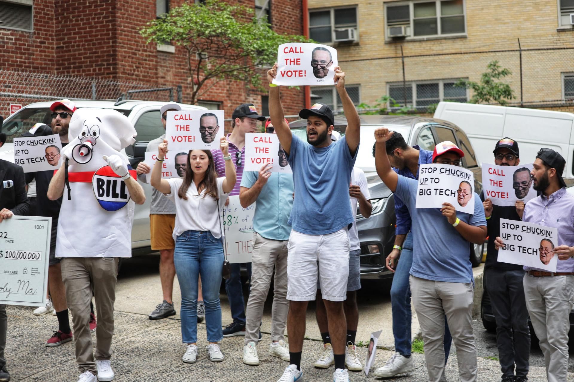 Activists demonstrate in Washington, D.C. on July 26, 2022 to urge Senate Majority Leader Chuck Schumer (D-N.Y.) to hold a vote on antitrust legislation.