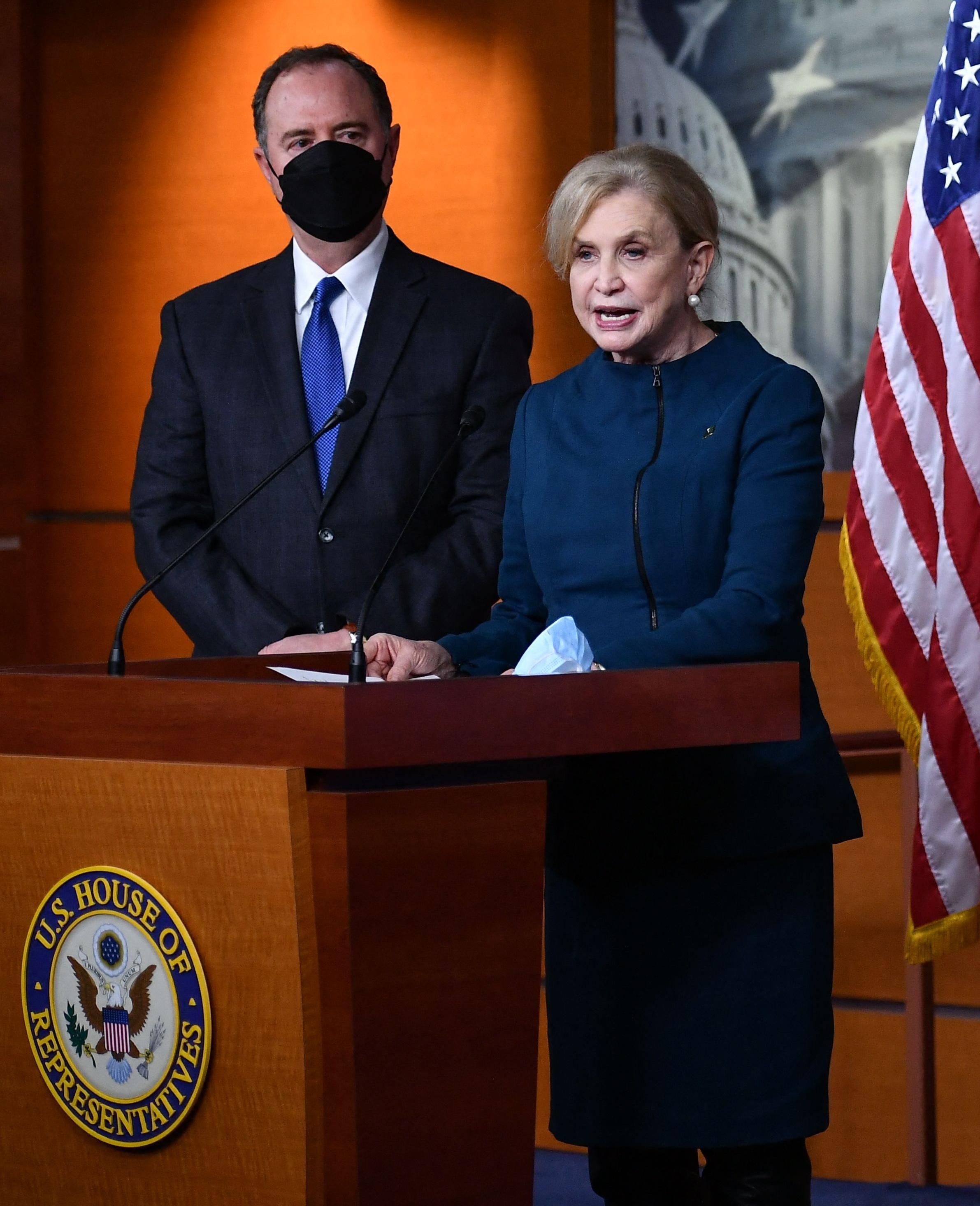 Rep. Carolyn Maloney (D-N.Y.) speaks and Rep. Adam Schiff (D-Calif.) listens during a press conference in Washington, D.C. on December 9, 2021.