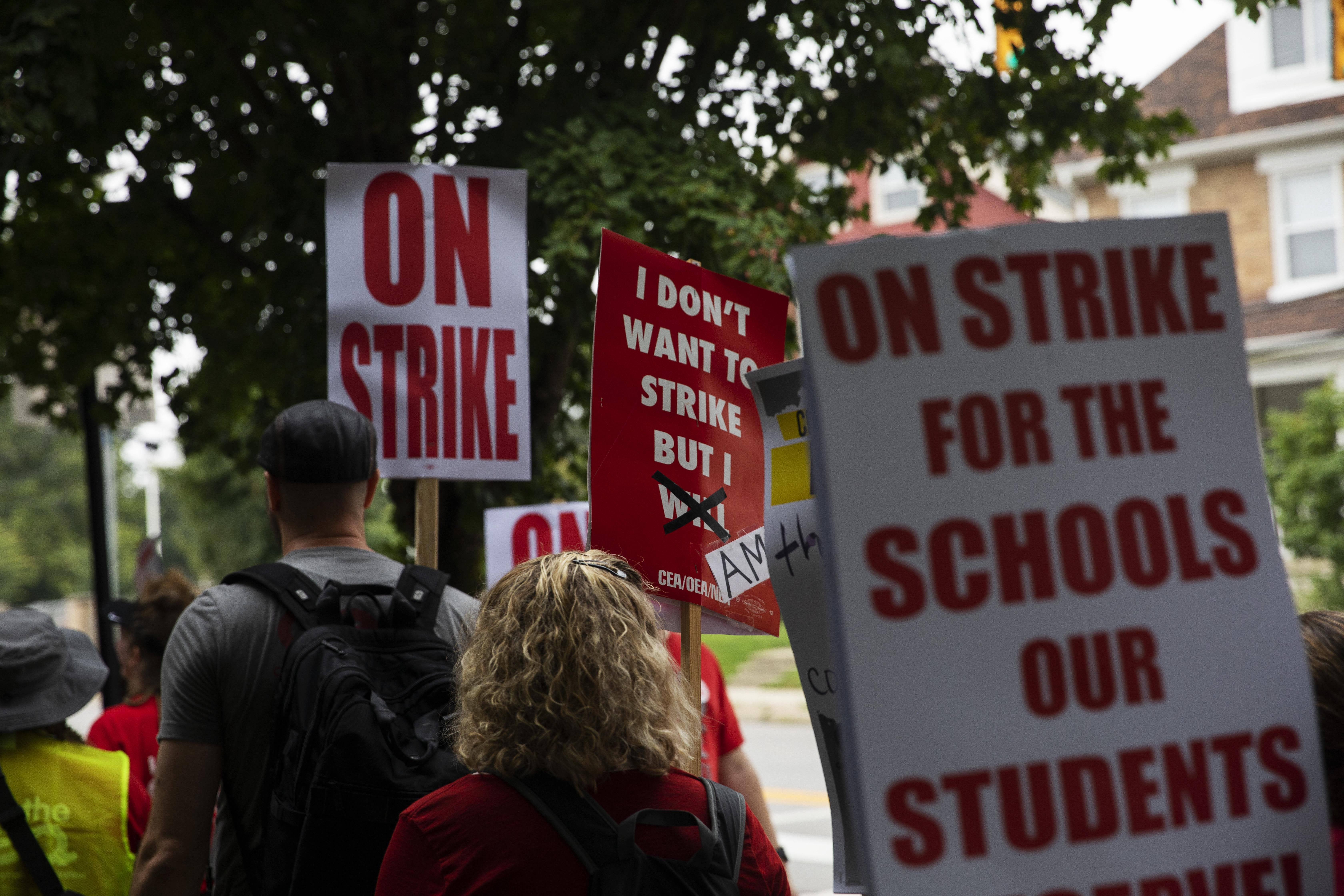 Columbus City School teachers strike outside of Livingston Elementary School in Columbus, Ohio on August 22, 2022.