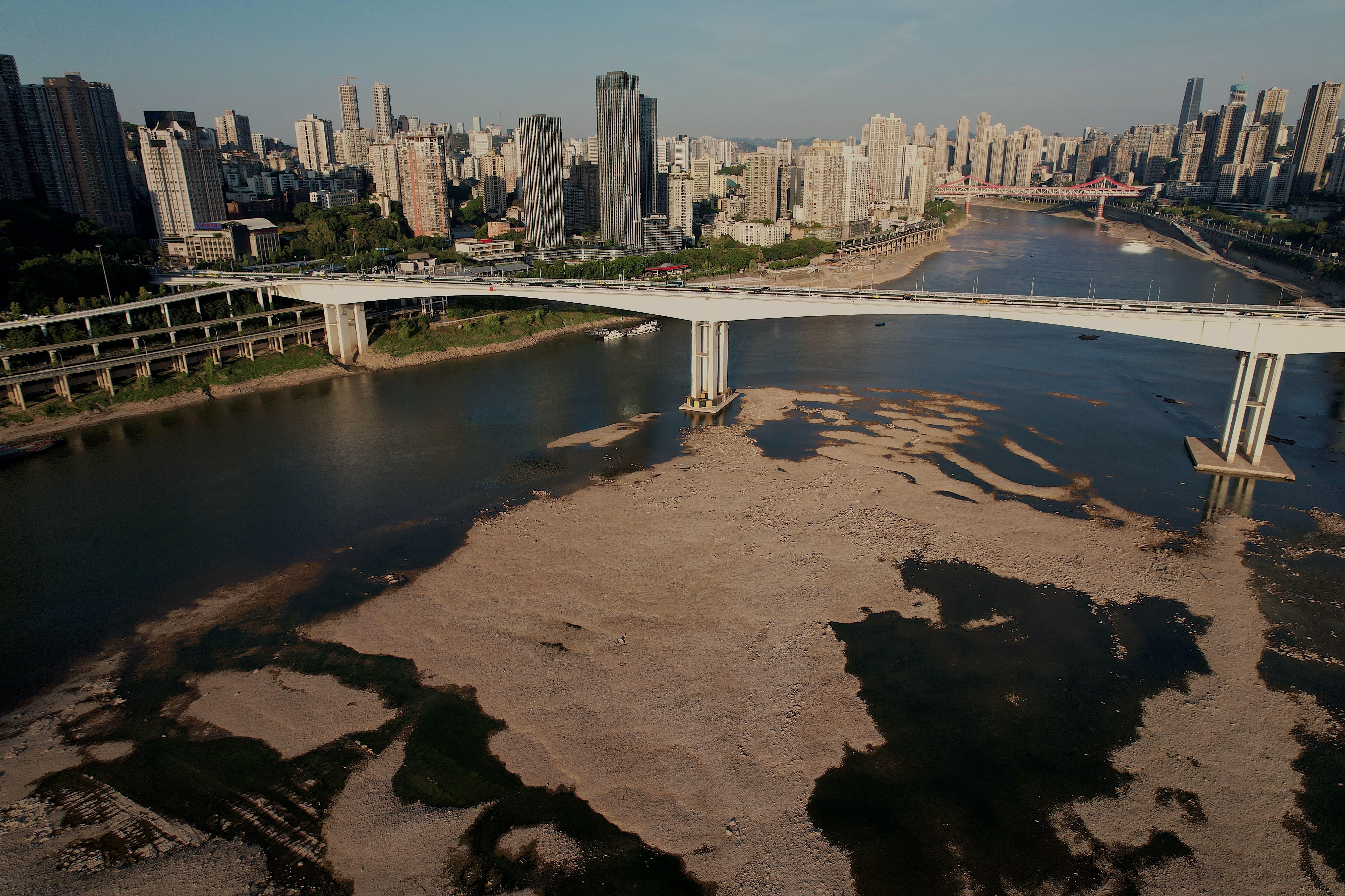 An aerial picture taken on August 24, 2022 shows the riverbed of the Jialing River, a tributary of the Yangtze River, in China's southwestern city of Chongqing. 