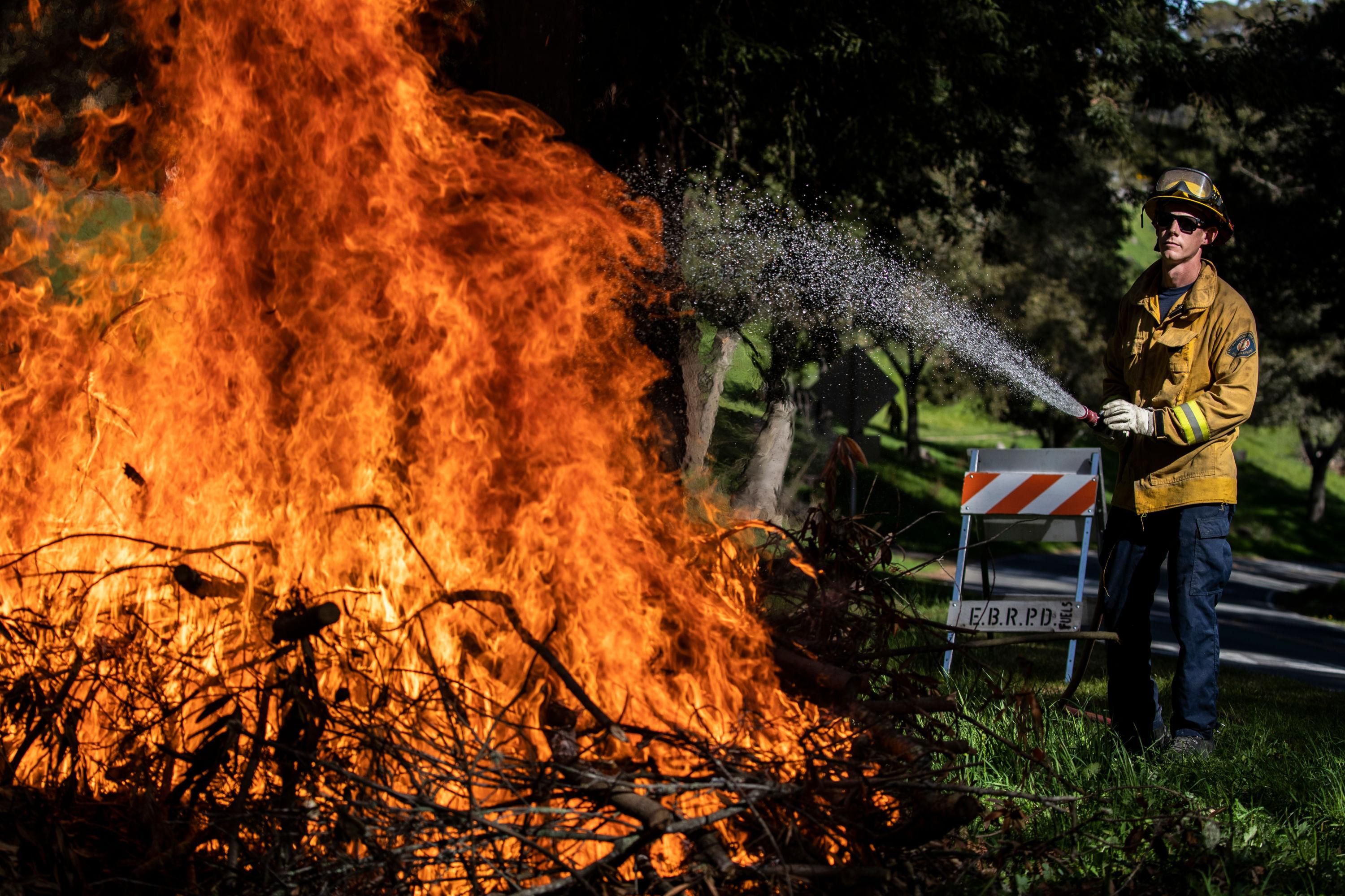 firefigher cools flames