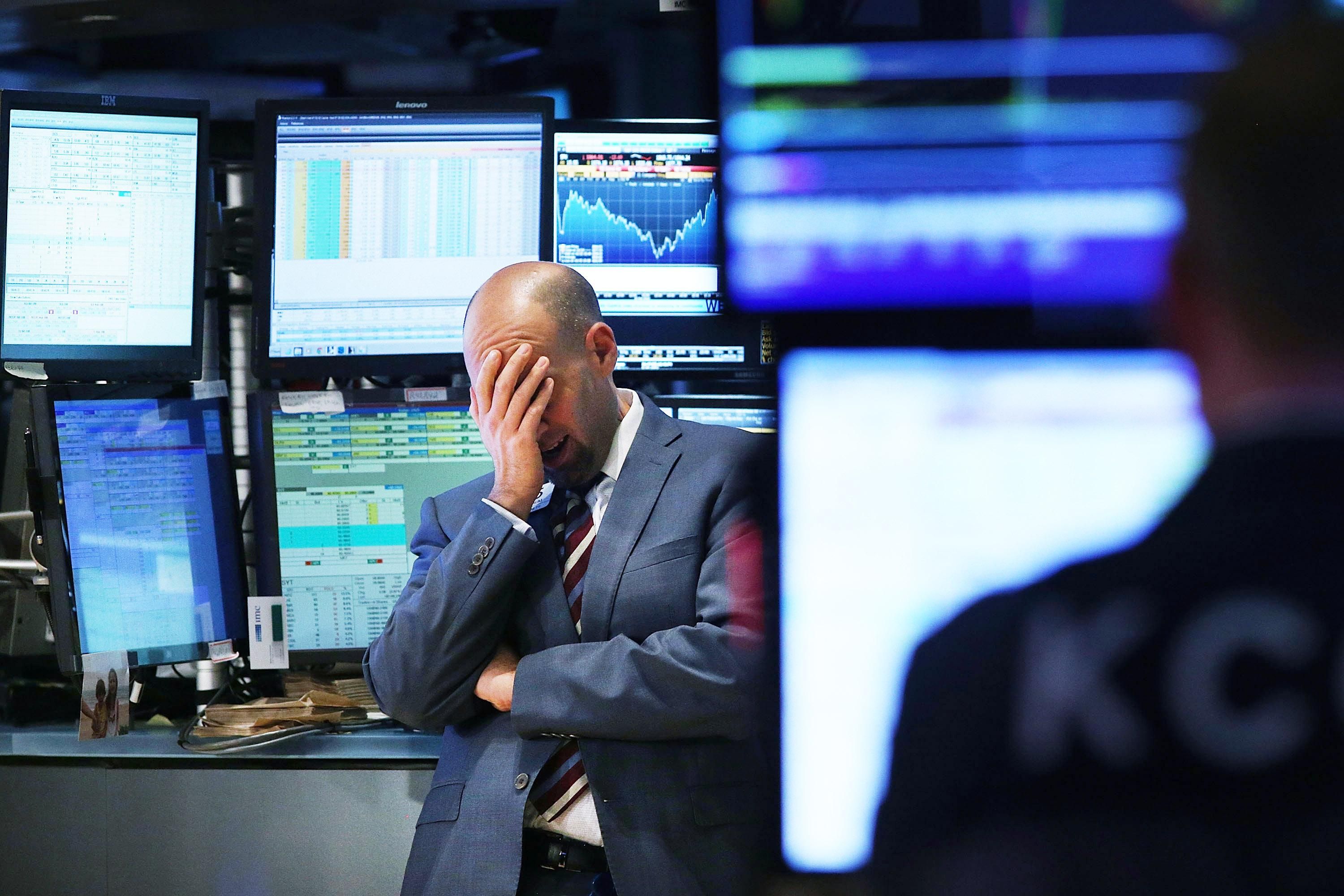 Sad trader on stock market floor