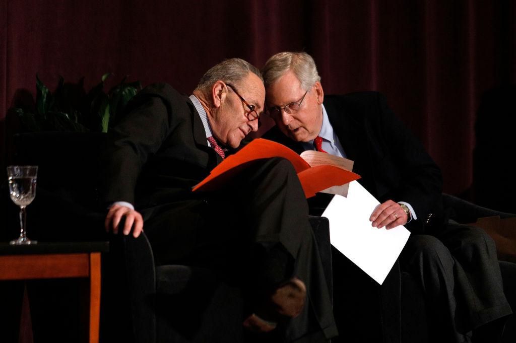 Chuck Schumer and Mitch McConnell speak at an event