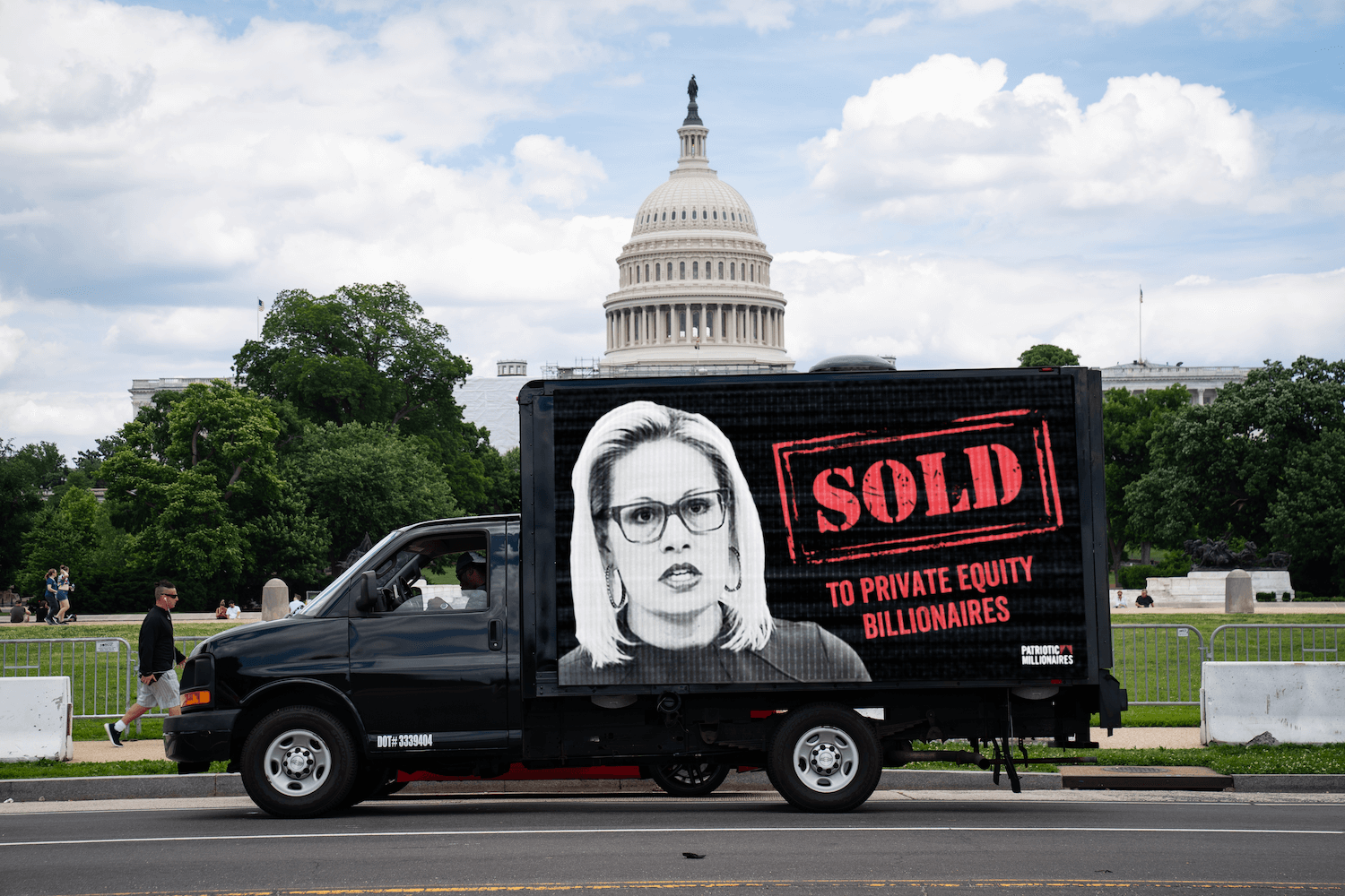 A mobile billboard criticizing Sen. Kyrsten Sinema (D-Ariz.) is seen in Washington, D.C. on August 8, 2022.