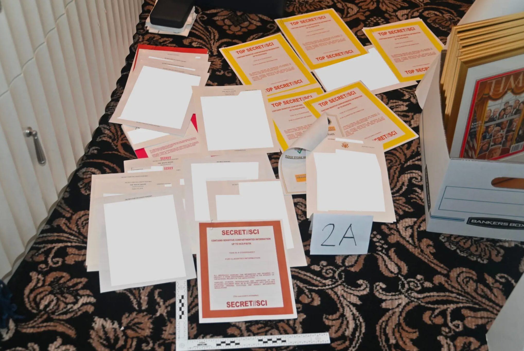 Classified documents are pictured on the floor of Trump's Florida home