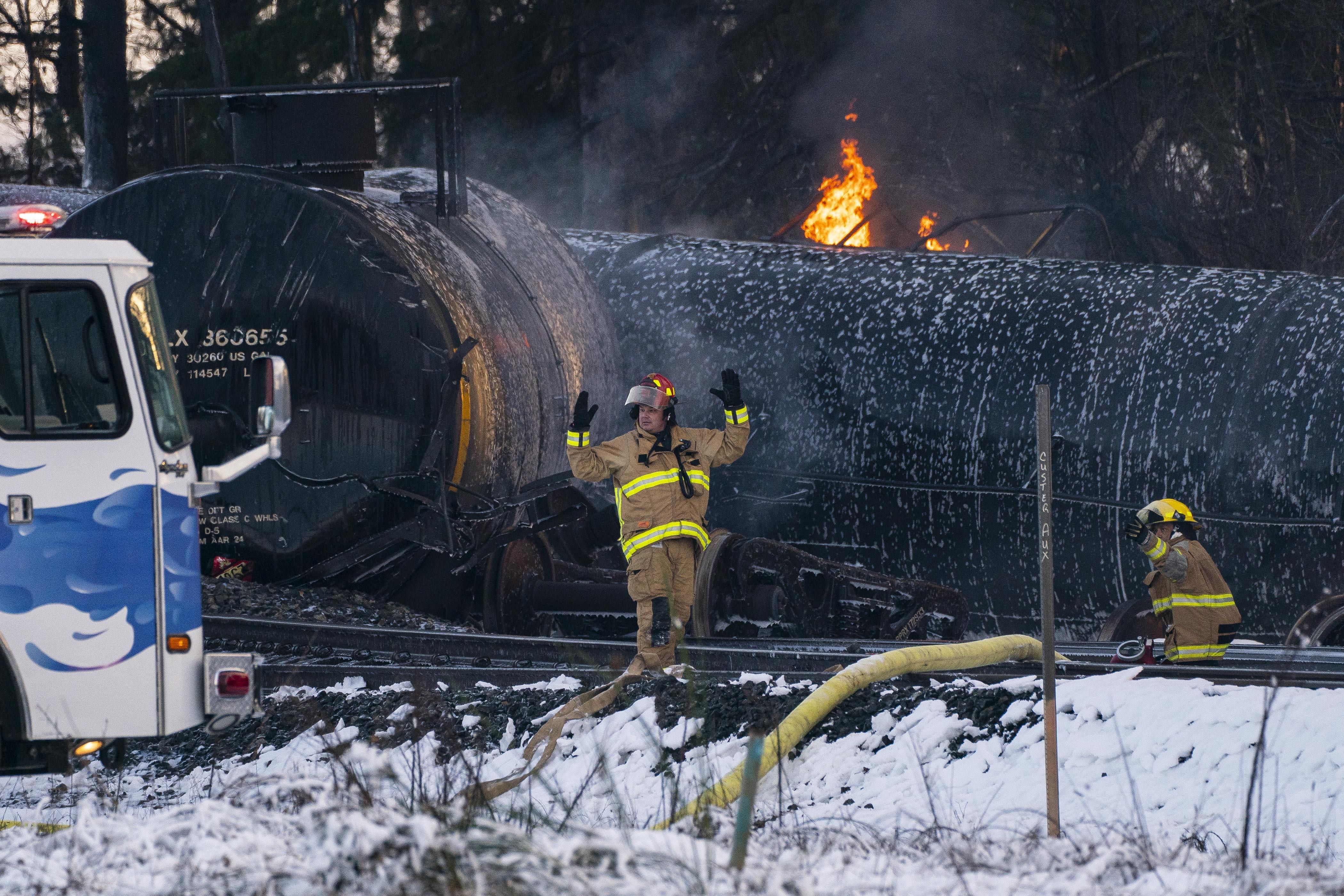 Firefighters respond after a train carrying crude oil derailed on December 22, 2020 in Custer, Washington.