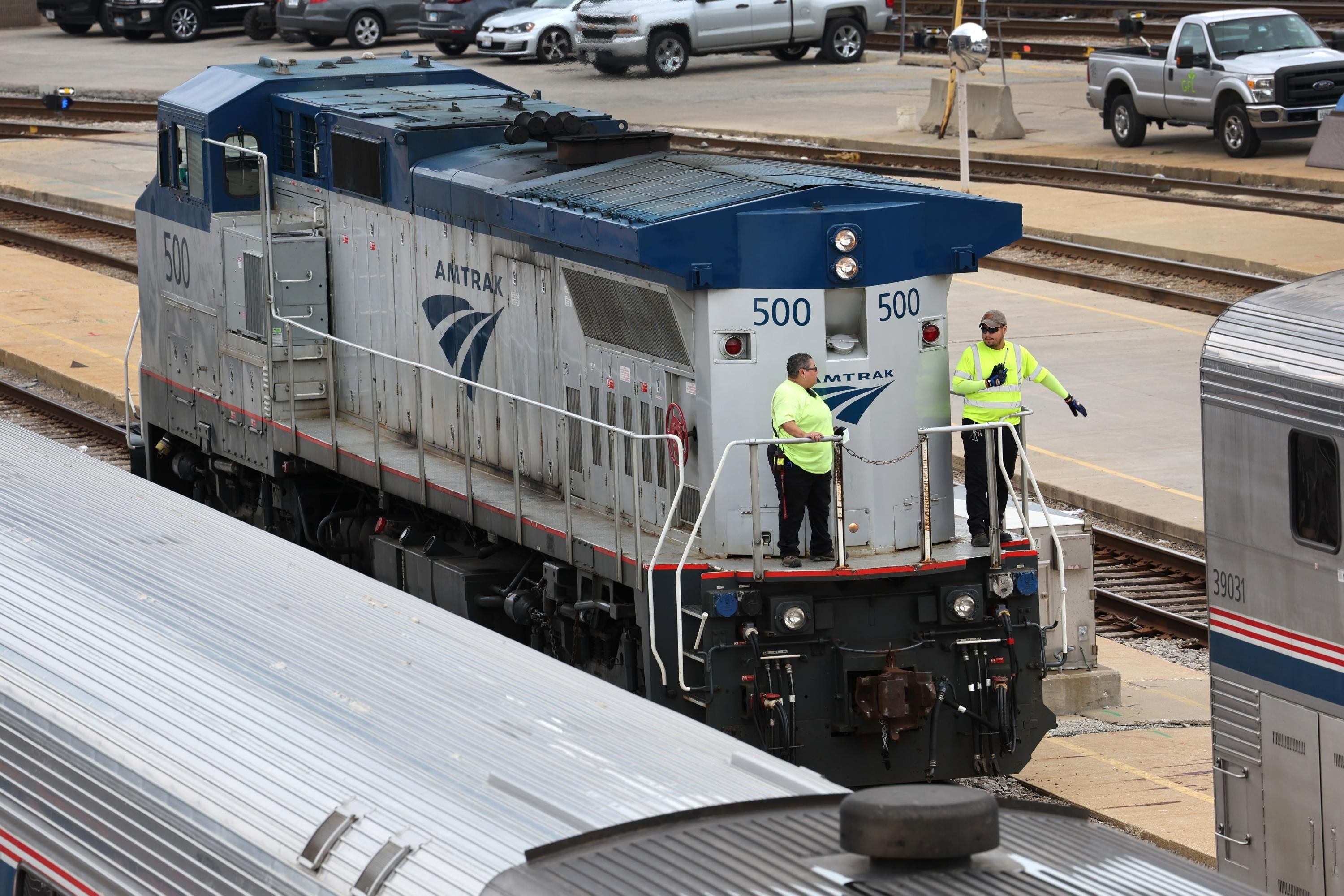 Amtrak workers service trains