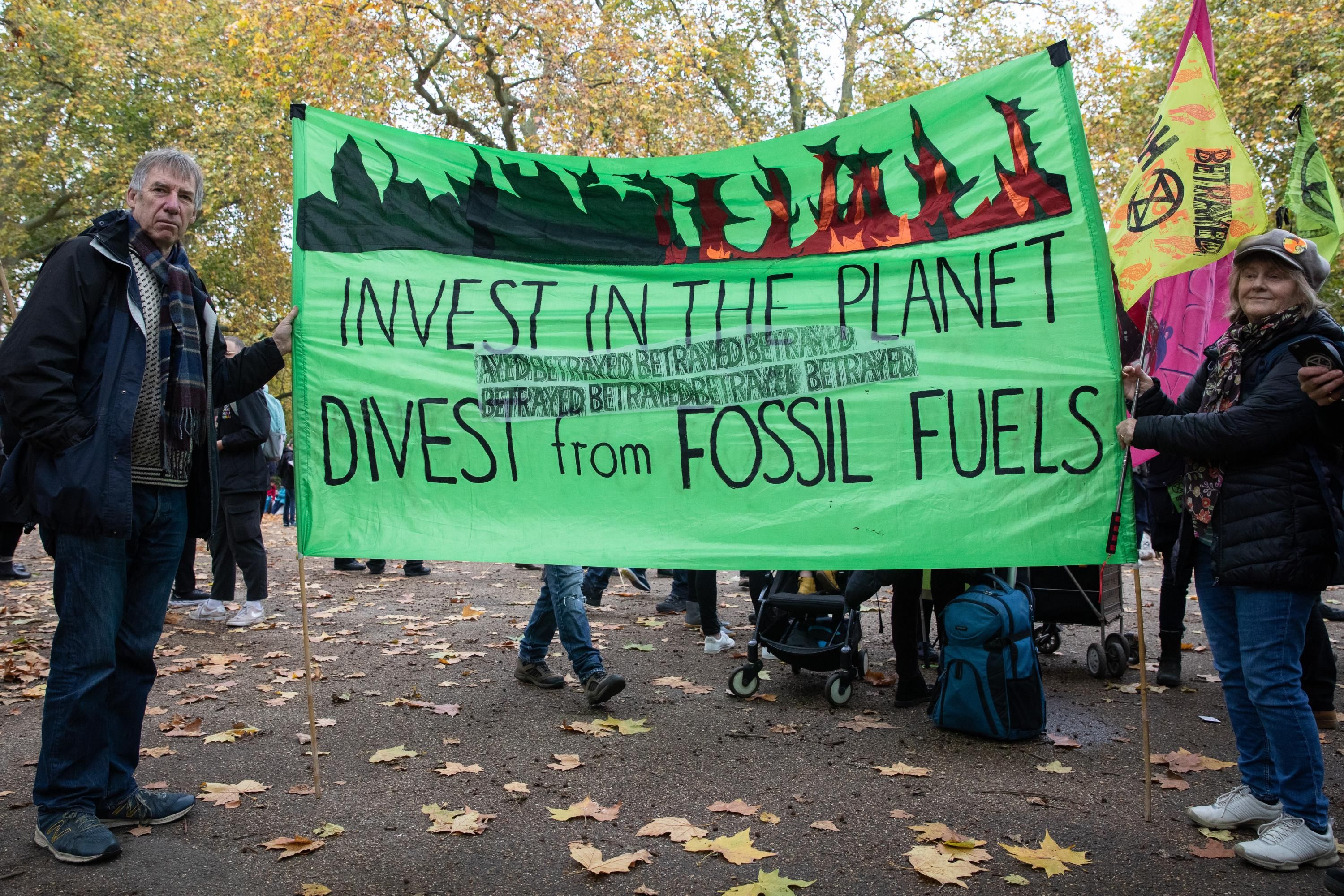 Sign reading, "Invest in the planet, divest from fossil fuels"