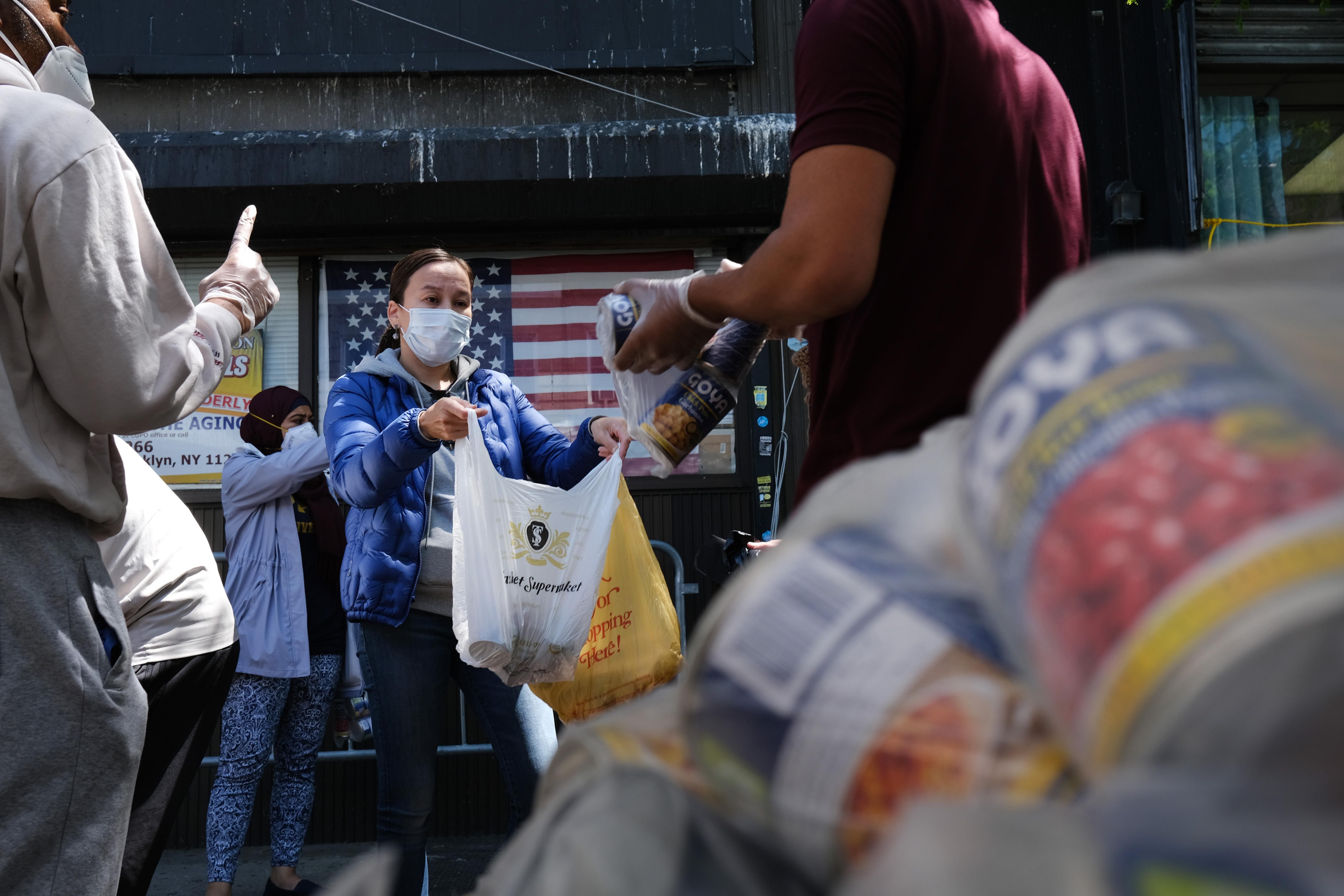 People collecting food at a food bank operation during the Covid-19 pandemic