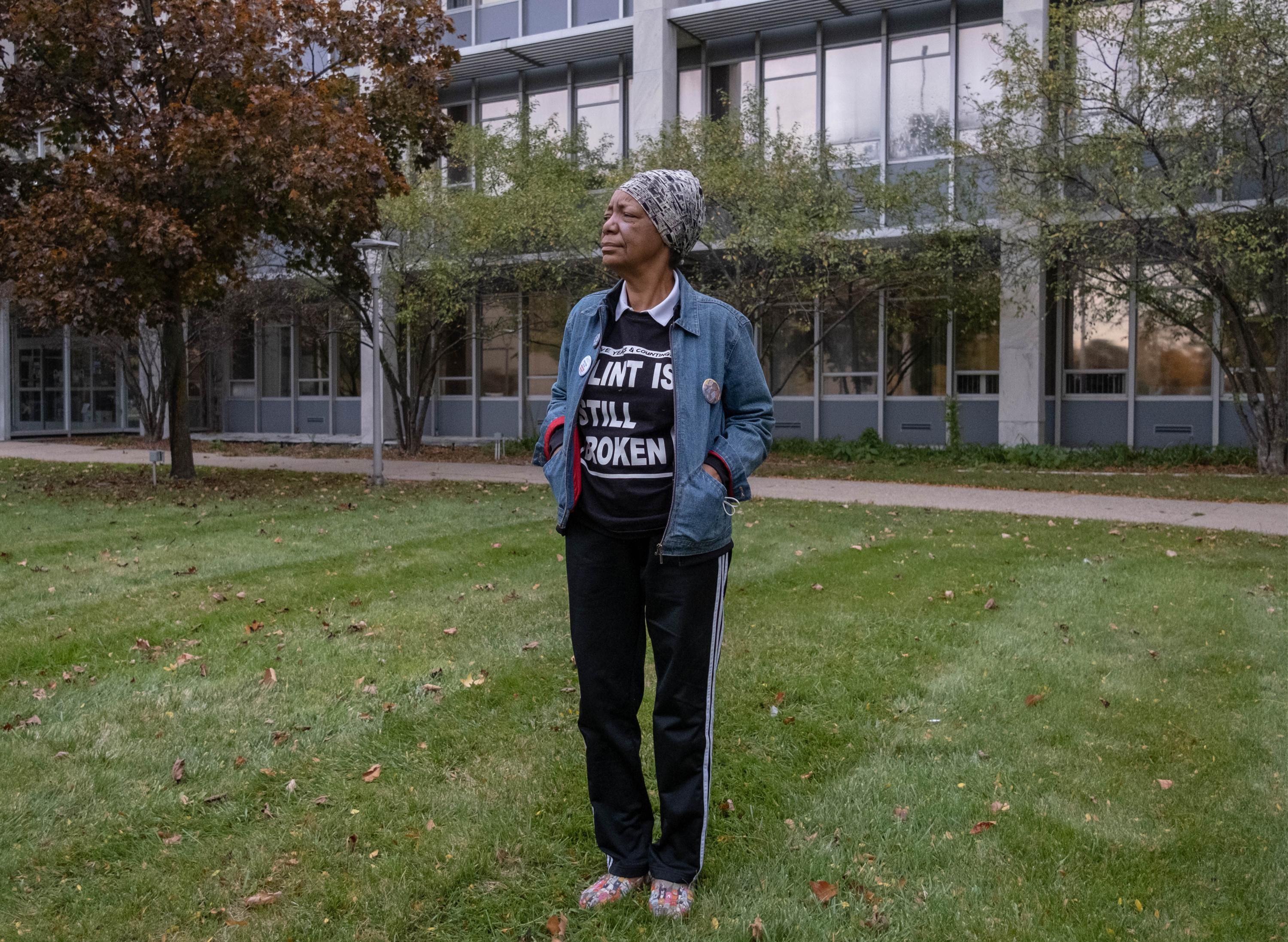 An activist stands outside City Hall in Flint, Michigan