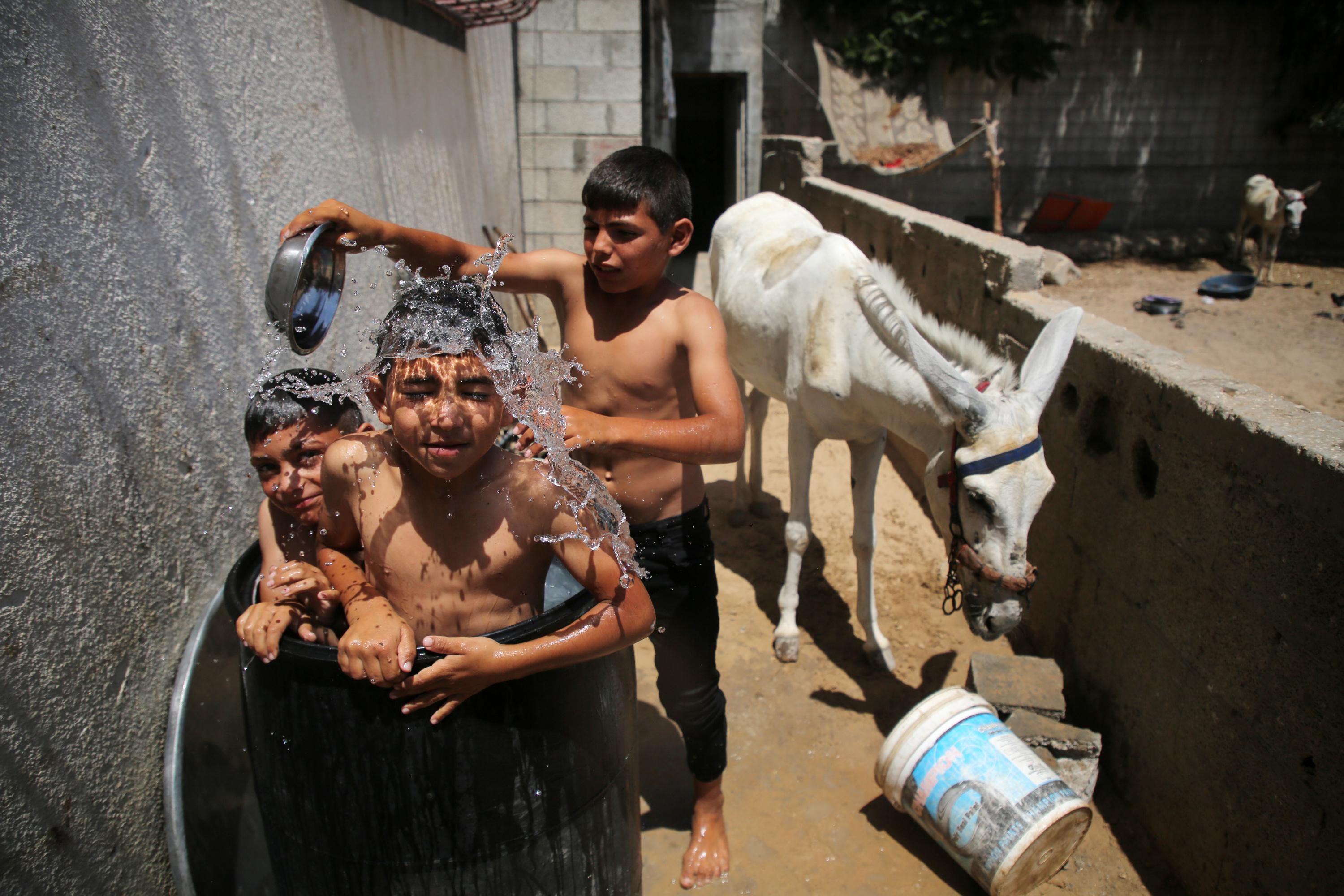 Palestinian children shower