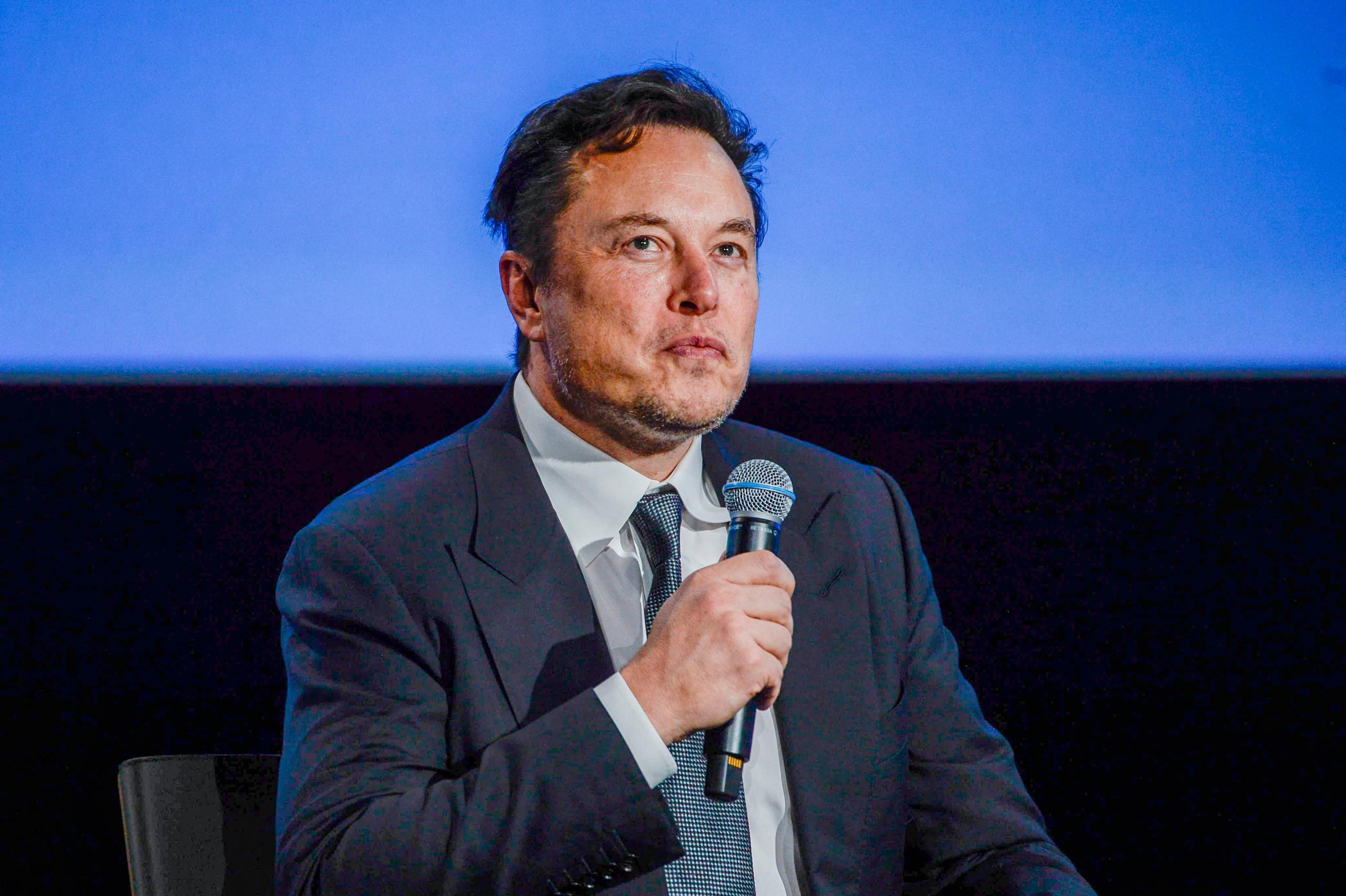 Elon Musk speaks to an audience