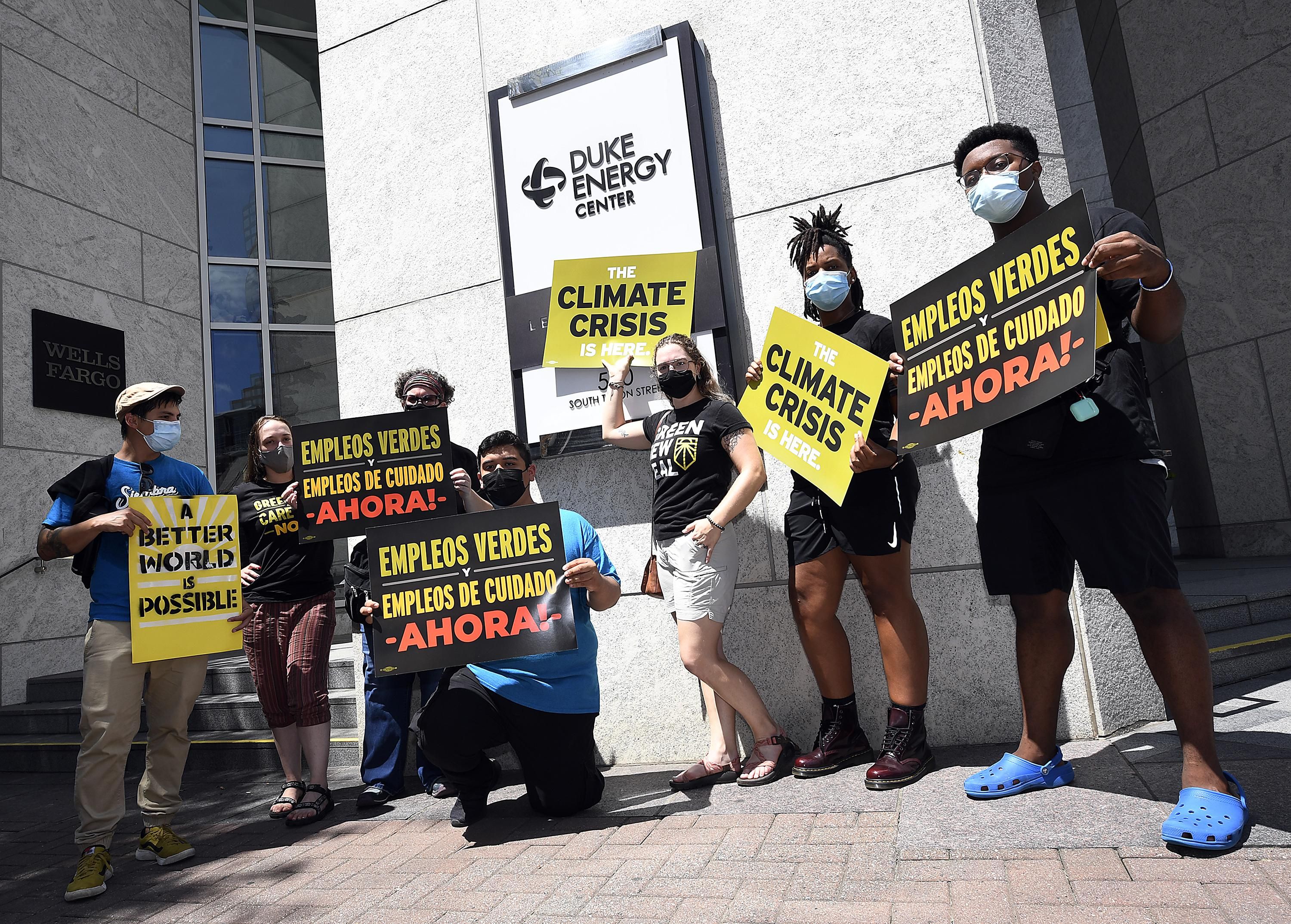 Climate campaigners outside Duke Energy Center
