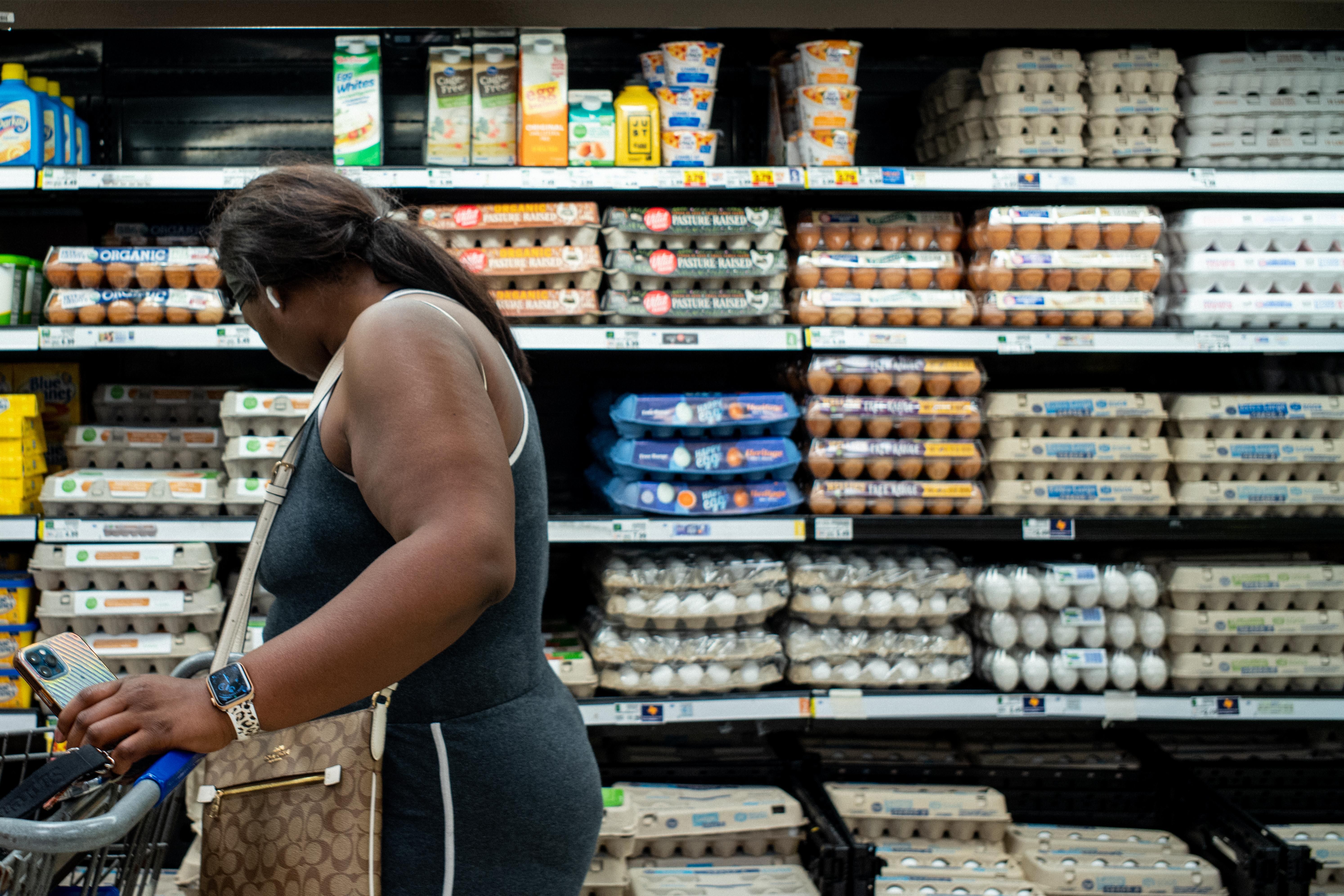 A customer shops for eggs at a Kroger grocery store on August 15, 2022 in Houston, Texas.