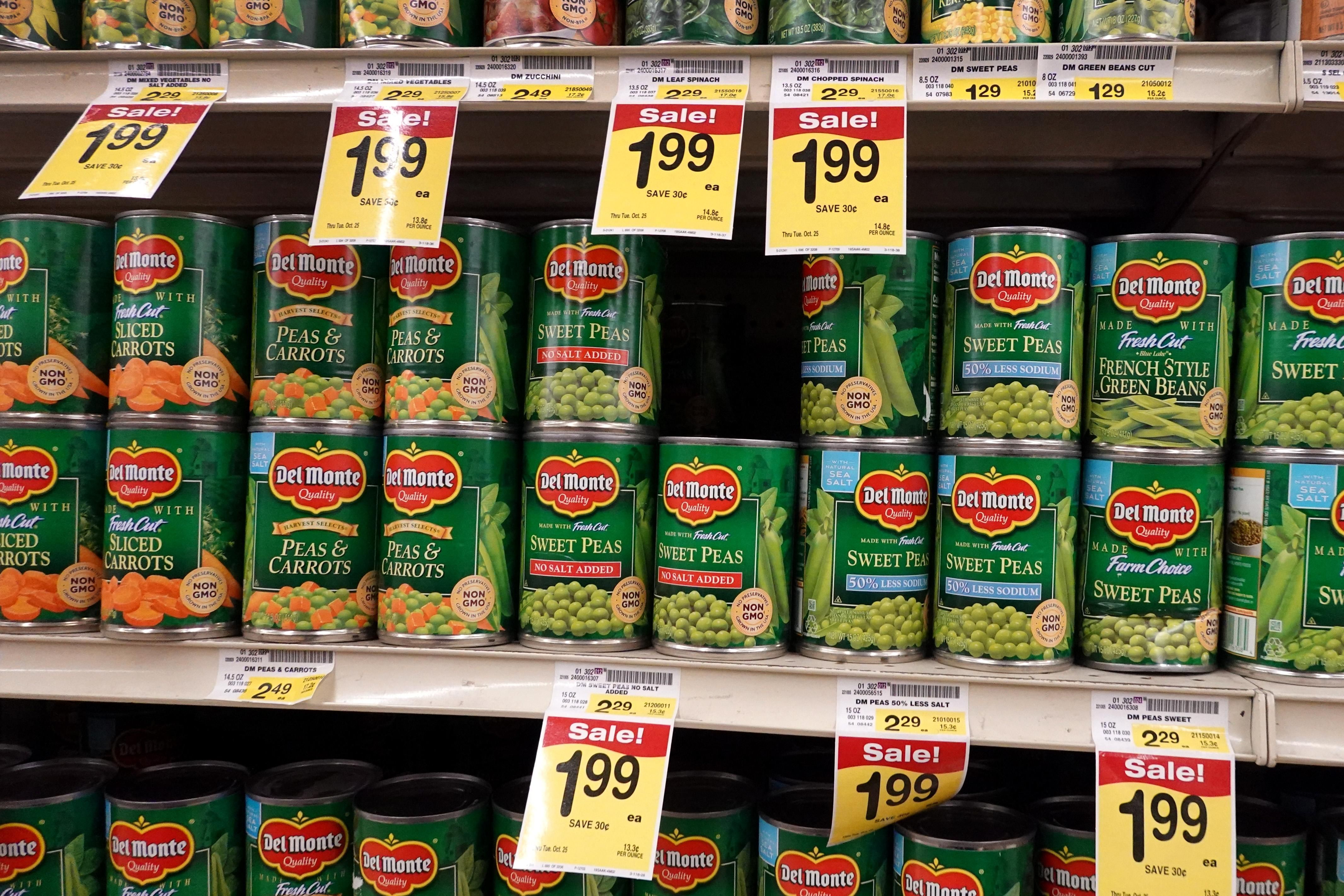 Canned vegetables on a grocery store shelf