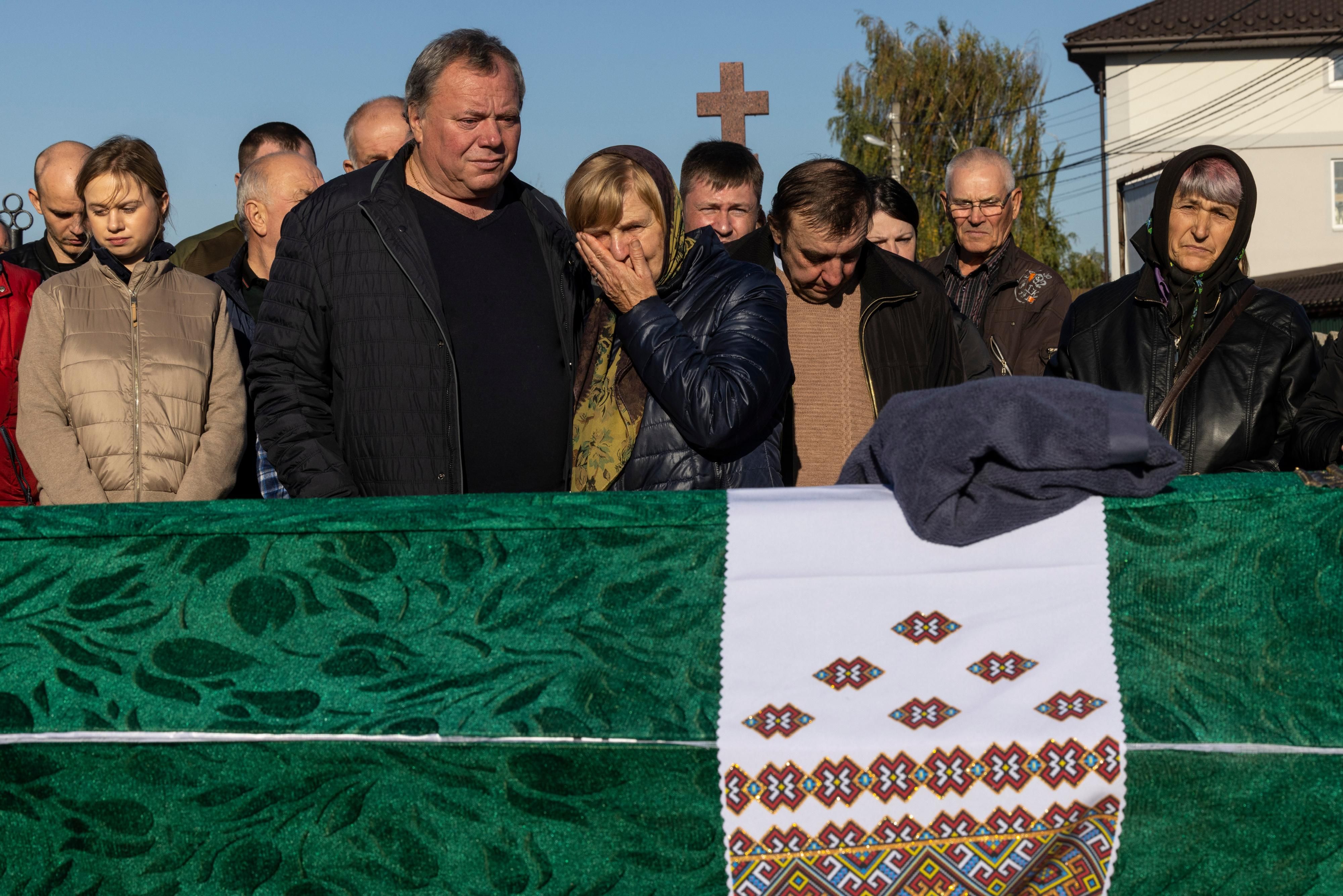 Mourners say goodbye to a loved one in Ukraine