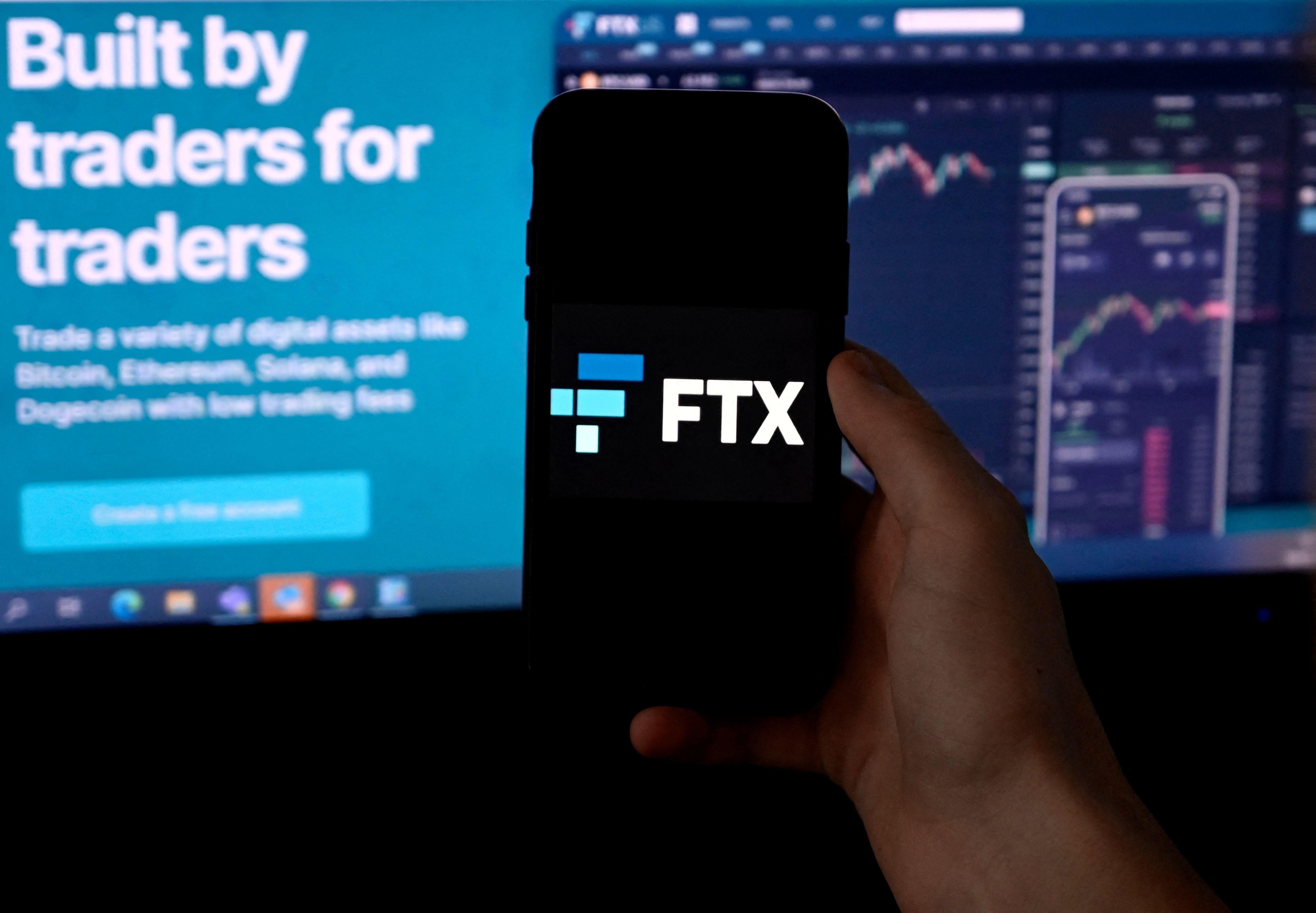 The logo of FTX, a cryptocurrency exchange platform, is shown on a smartphone screen in Arlington, Virginia on February 10, 2022.
