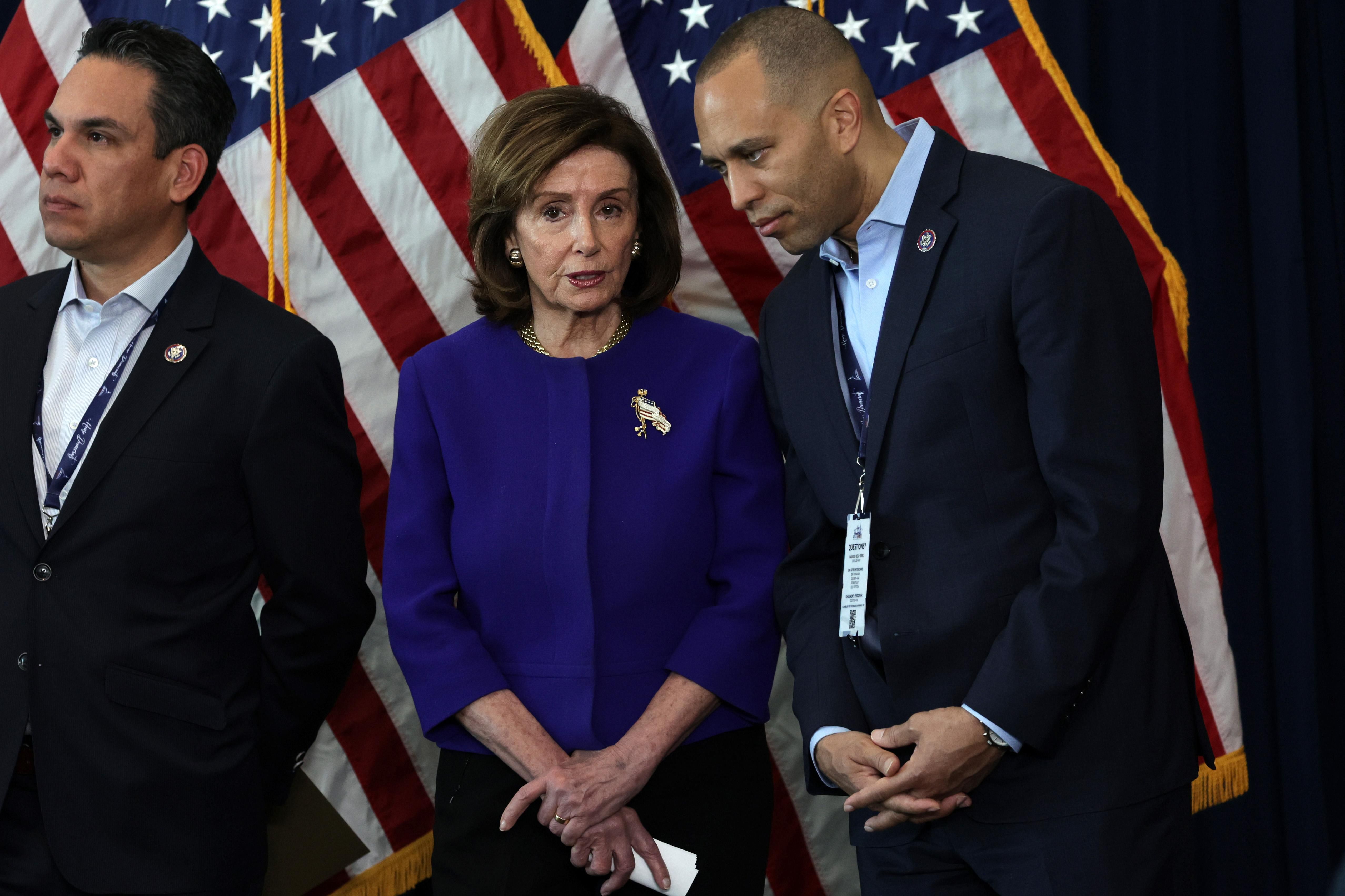 Nancy Pelosi speaking with Jakeem Jeffries