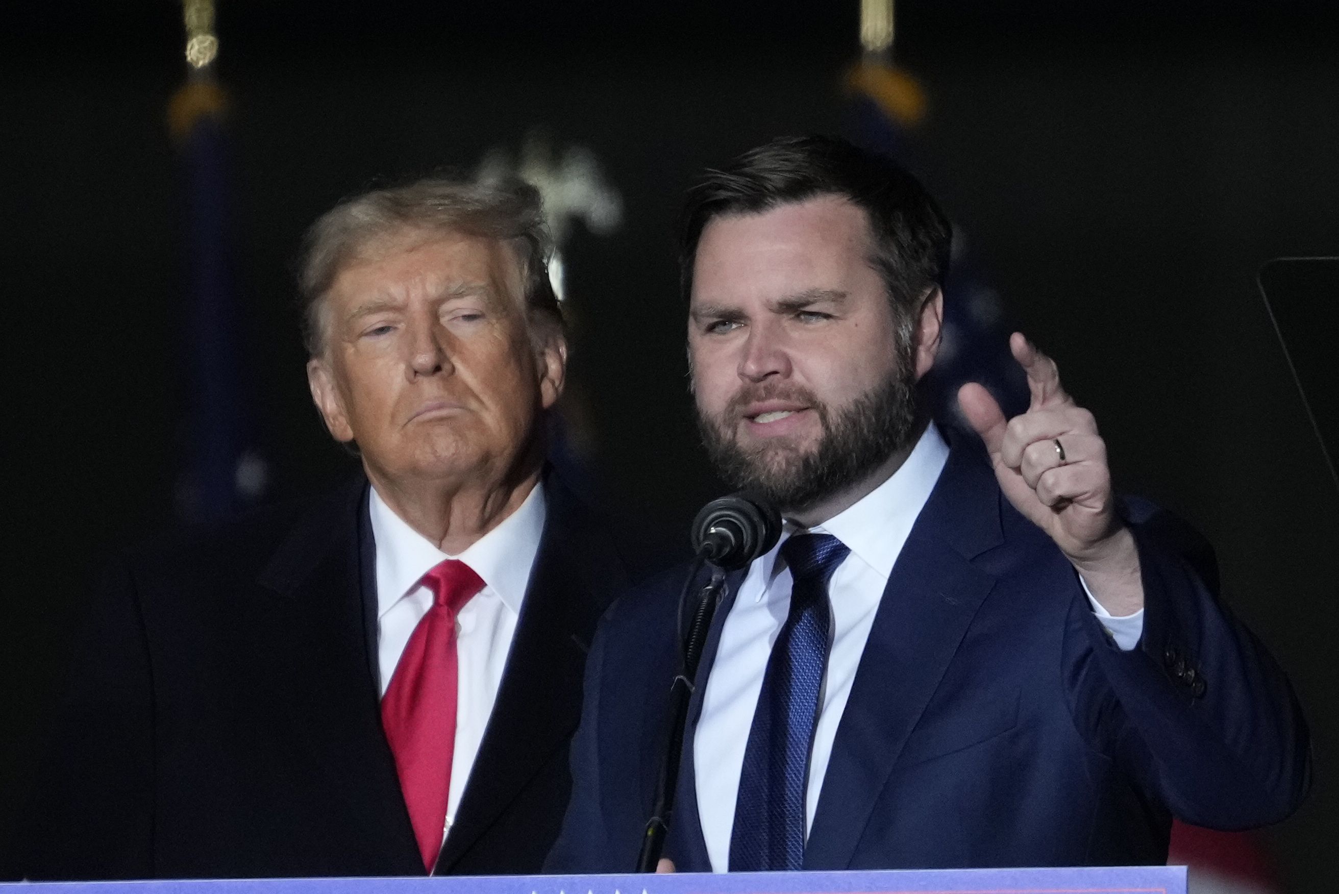 Former U.S. President Donald Trump and Republican U.S. Senate candidate J.D. Vance greet supporters during a rally on November 7, 2022 in Vandalia, Ohio.