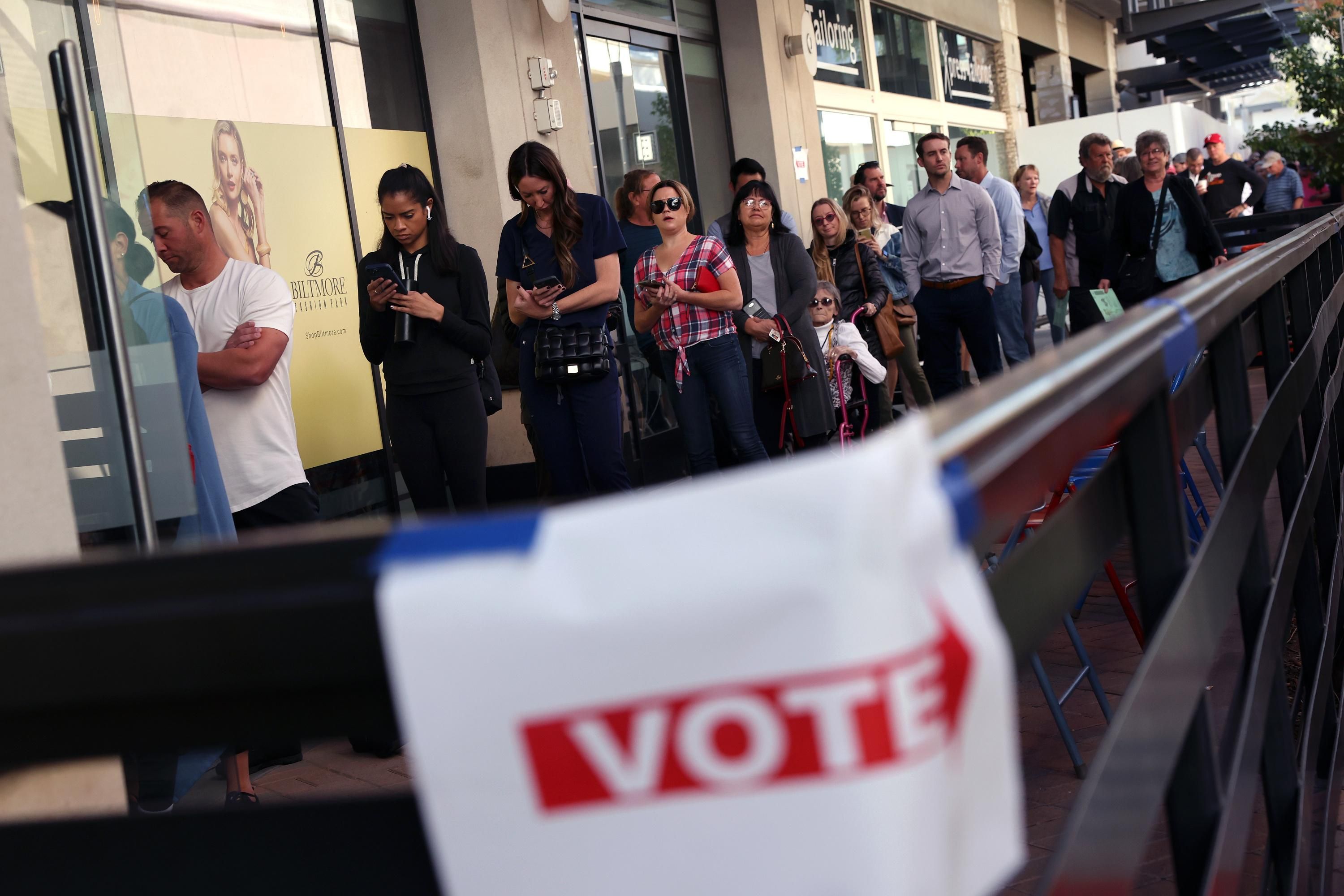 Voters wait to cast their ballots in Phoenix